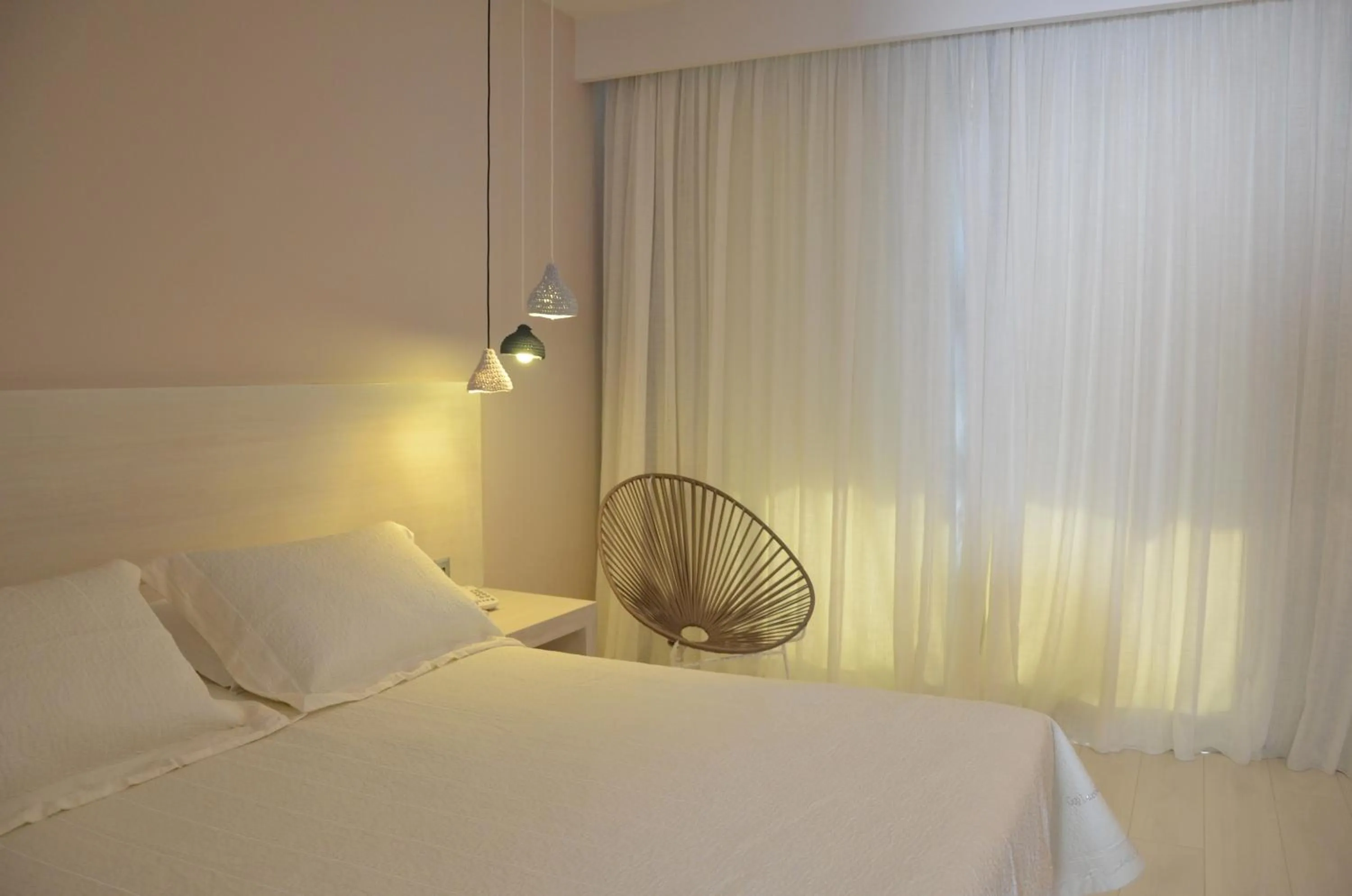 Bed in Ino Hotel & Suites