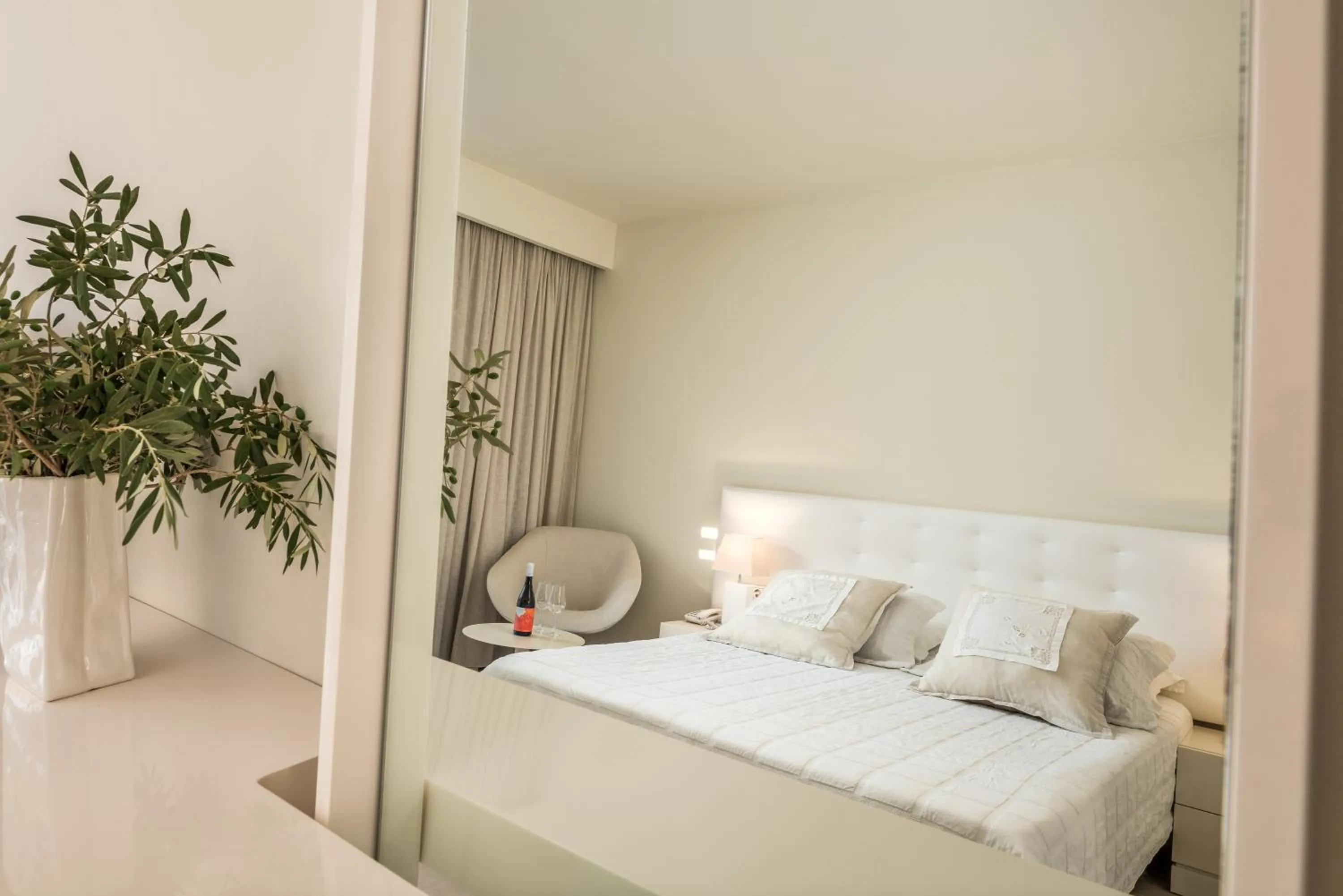 Bed in Ino Hotel & Suites