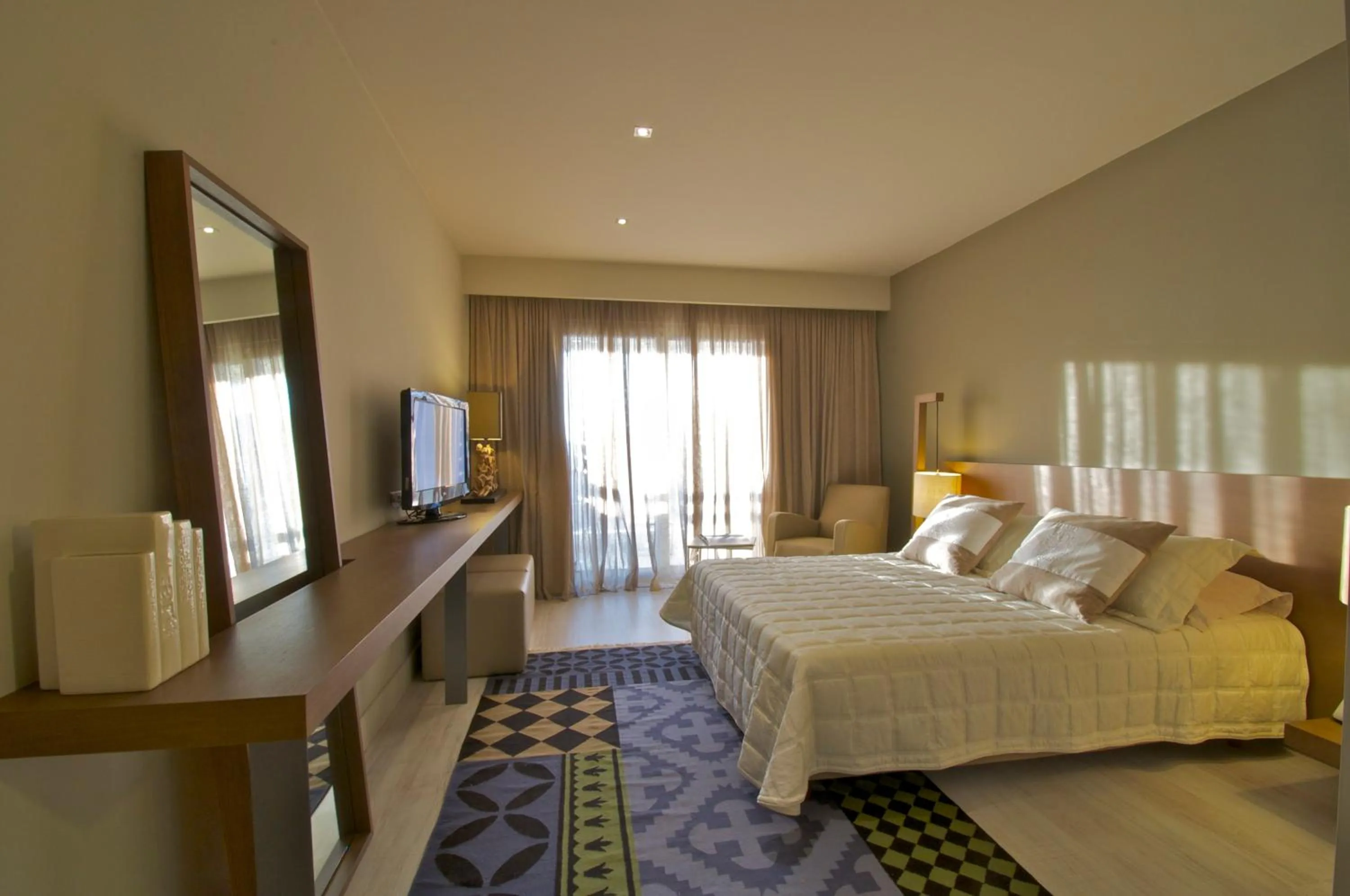 Bed in Ino Hotel & Suites