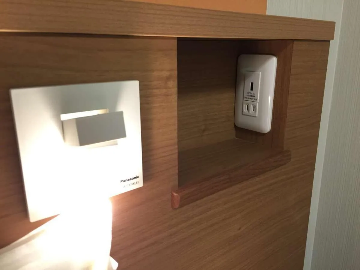 Bed in Hotel WBF Grande Asahikawa