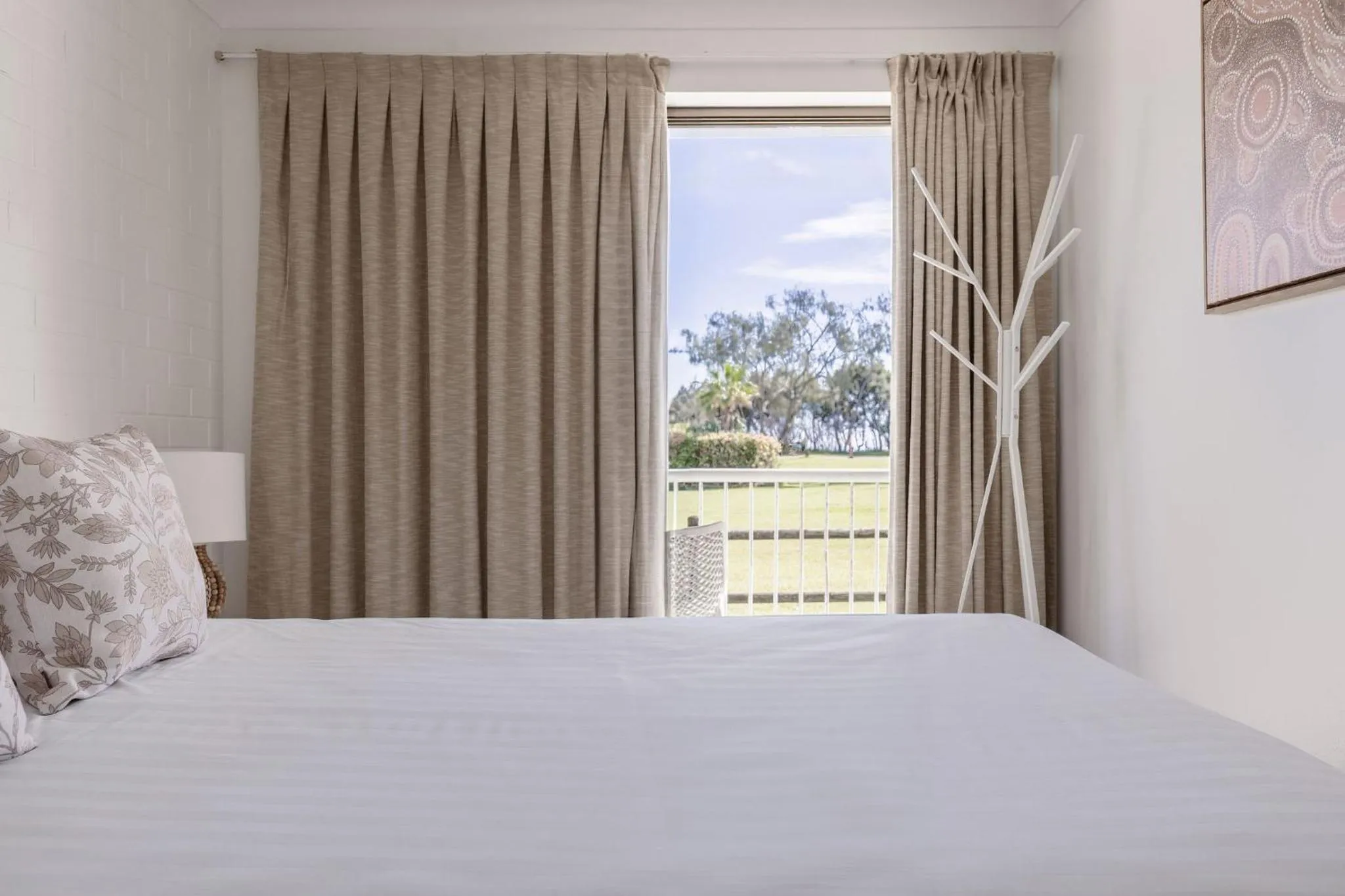 Bed in Main Beach Apartments