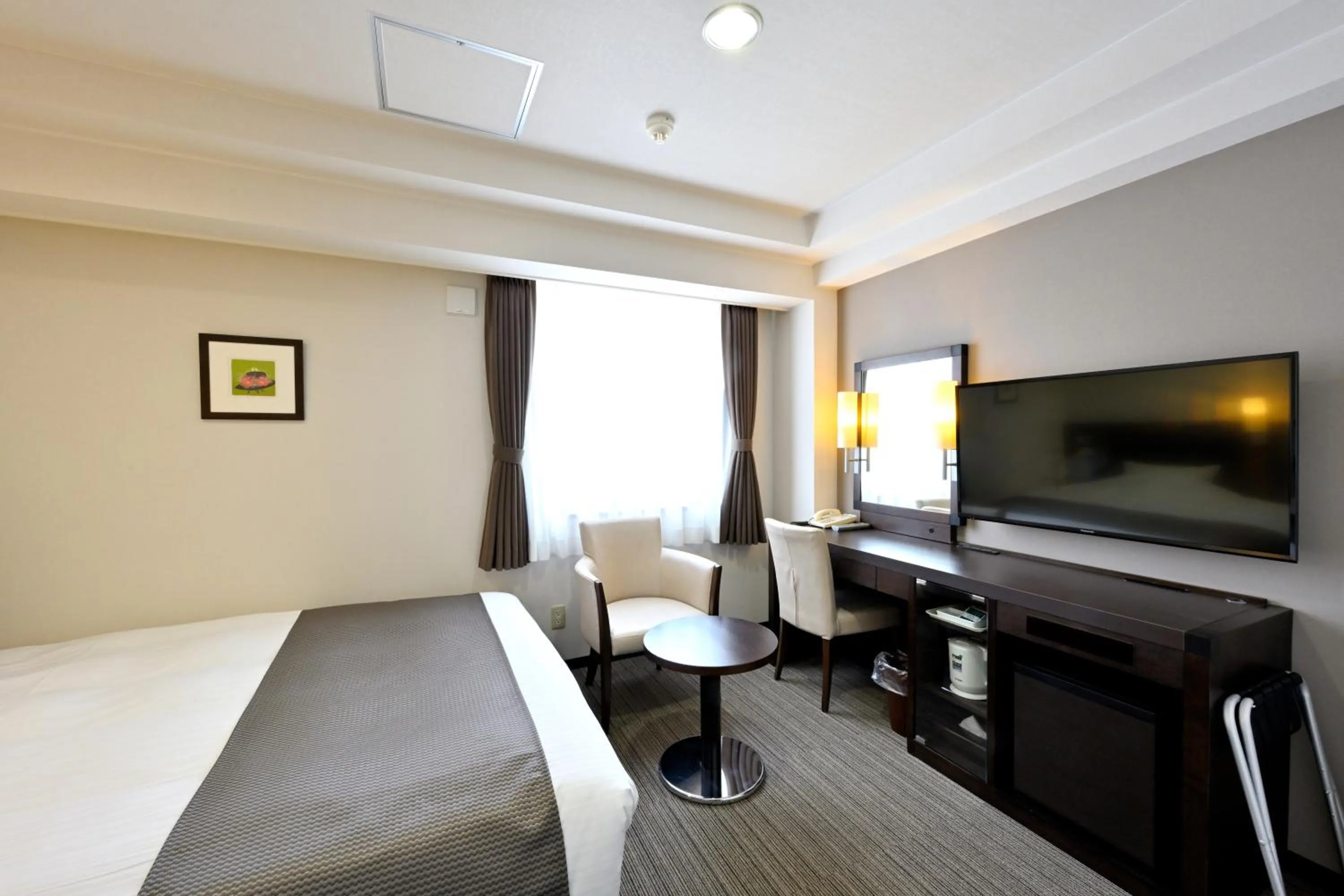 Bed in Saijo Urban Hotel