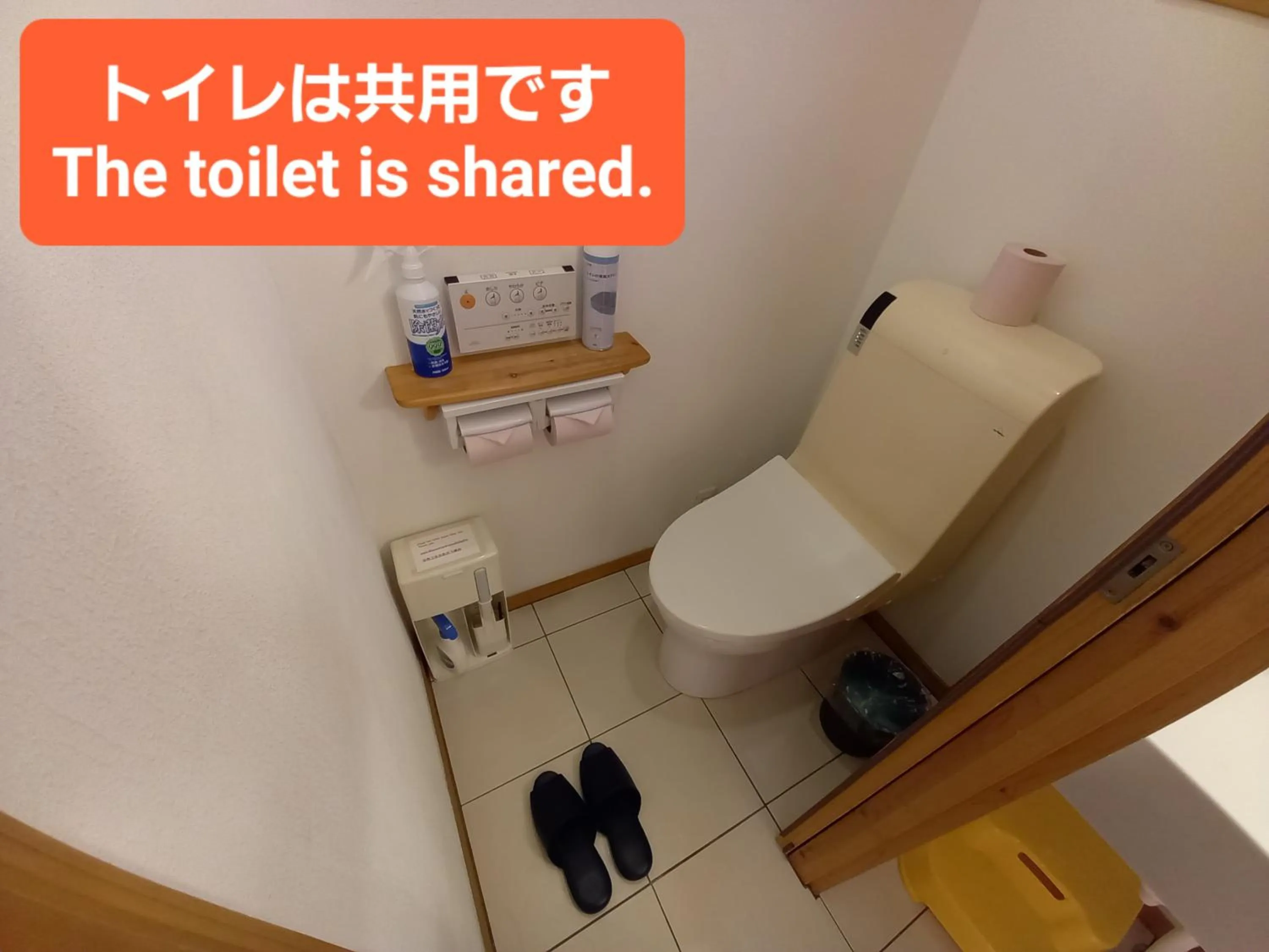 Toilet in Orange Cabin Inn far from station