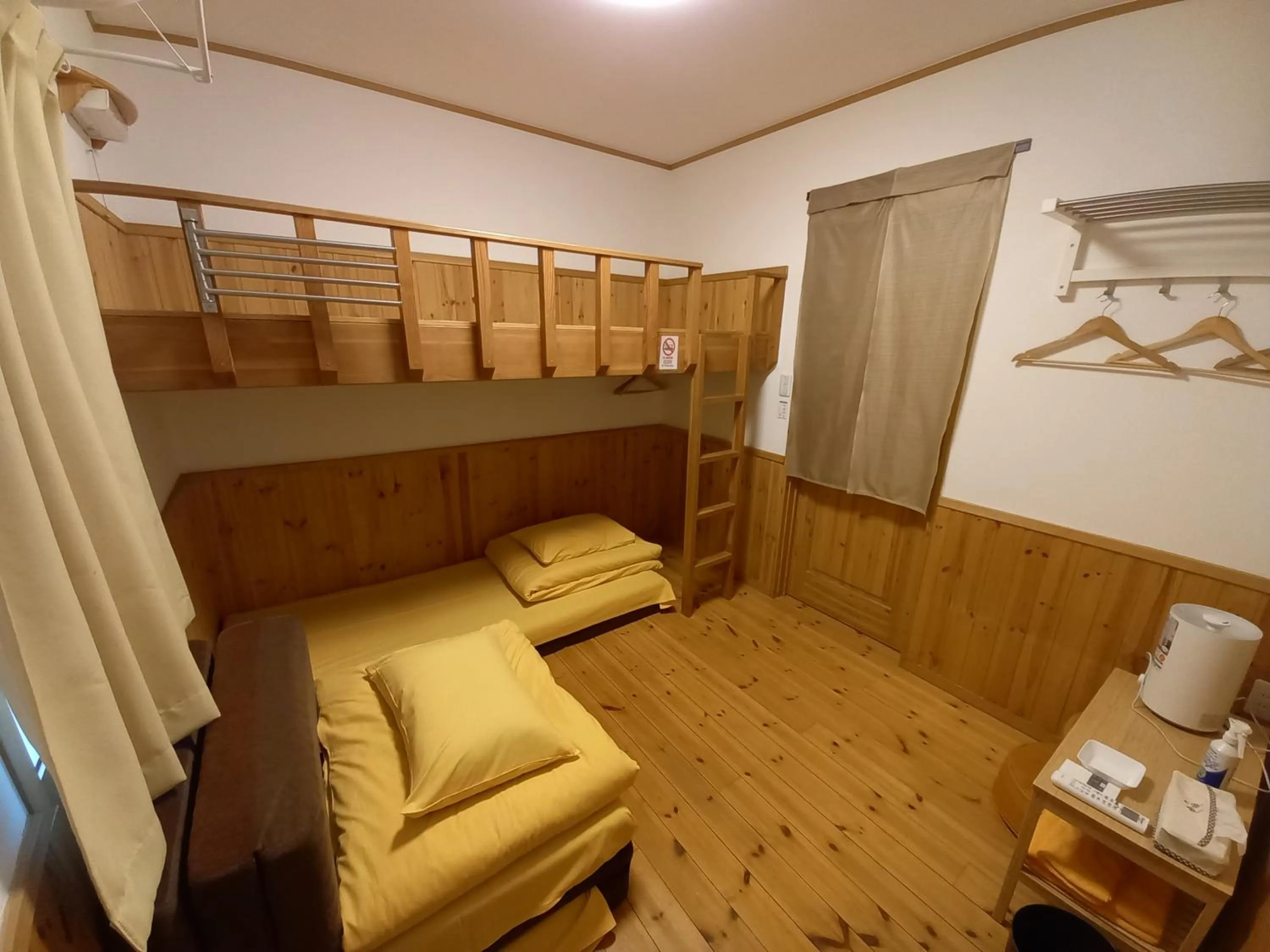 Bedroom in Orange Cabin Inn far from station