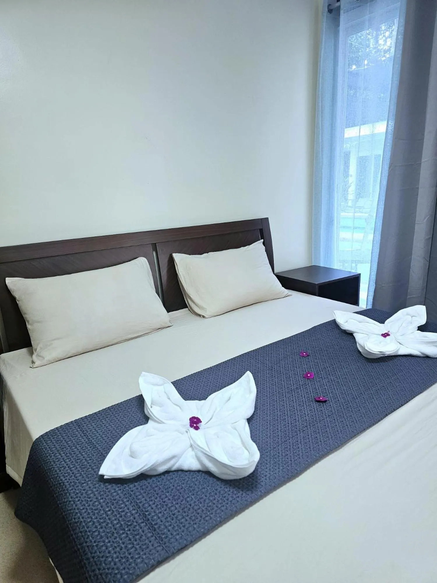 Bed in Mangotree Apartel & Resort