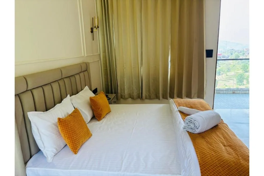 Bed in Yashasvi Himalayan Resort