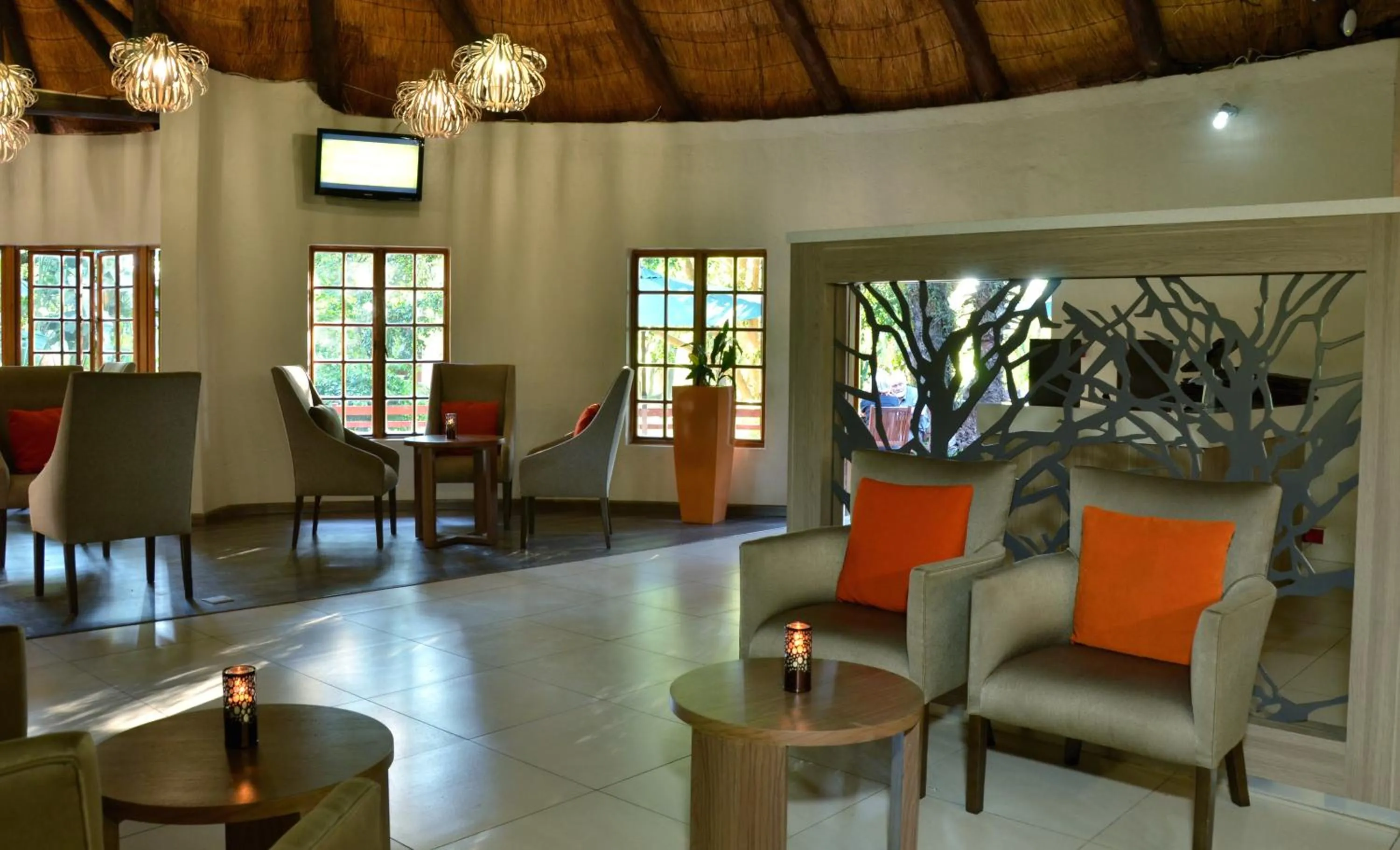 Communal lounge/ TV room in Cresta Marang Gardens Hotel