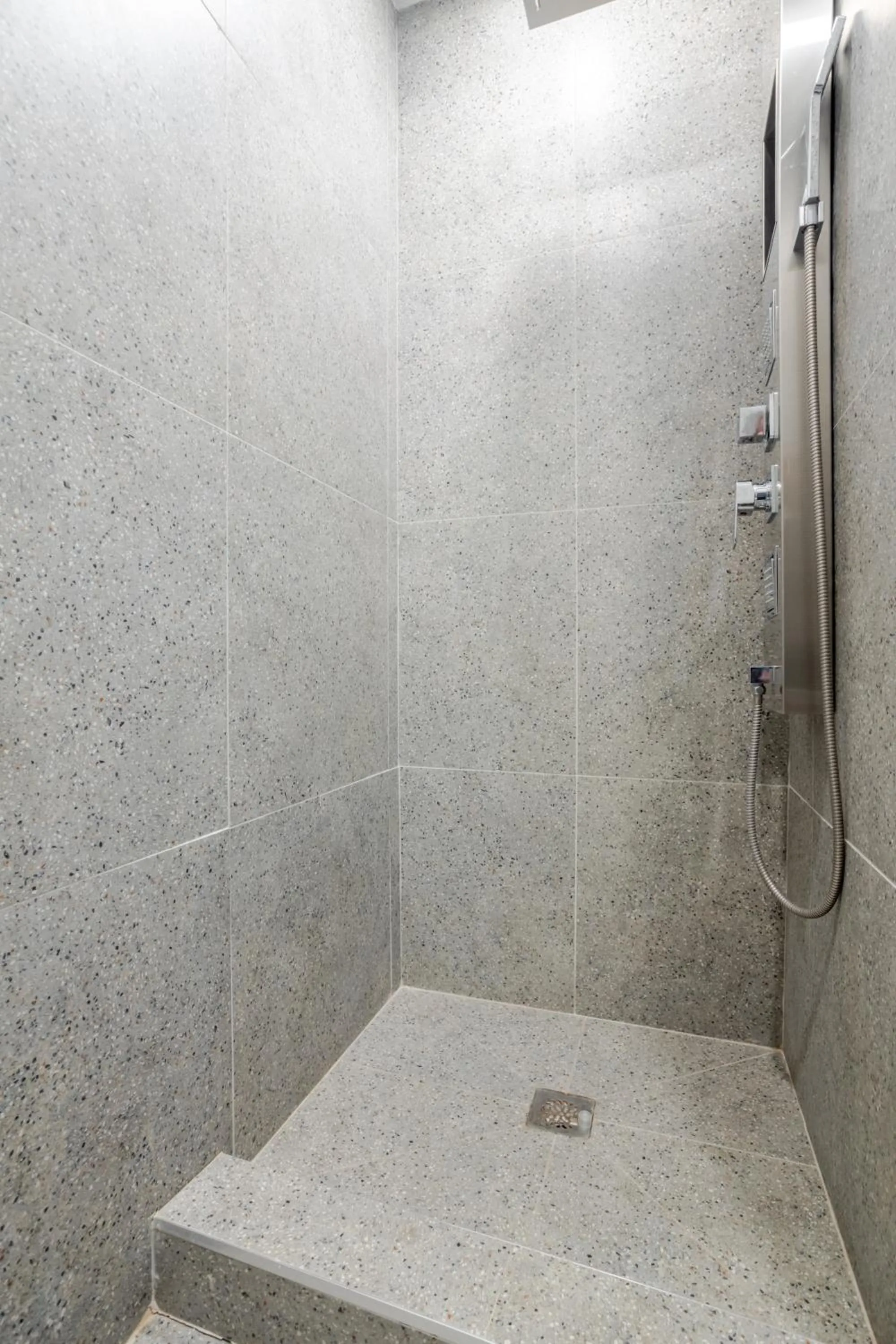 Shower in Olympia Hotel by Lodgo