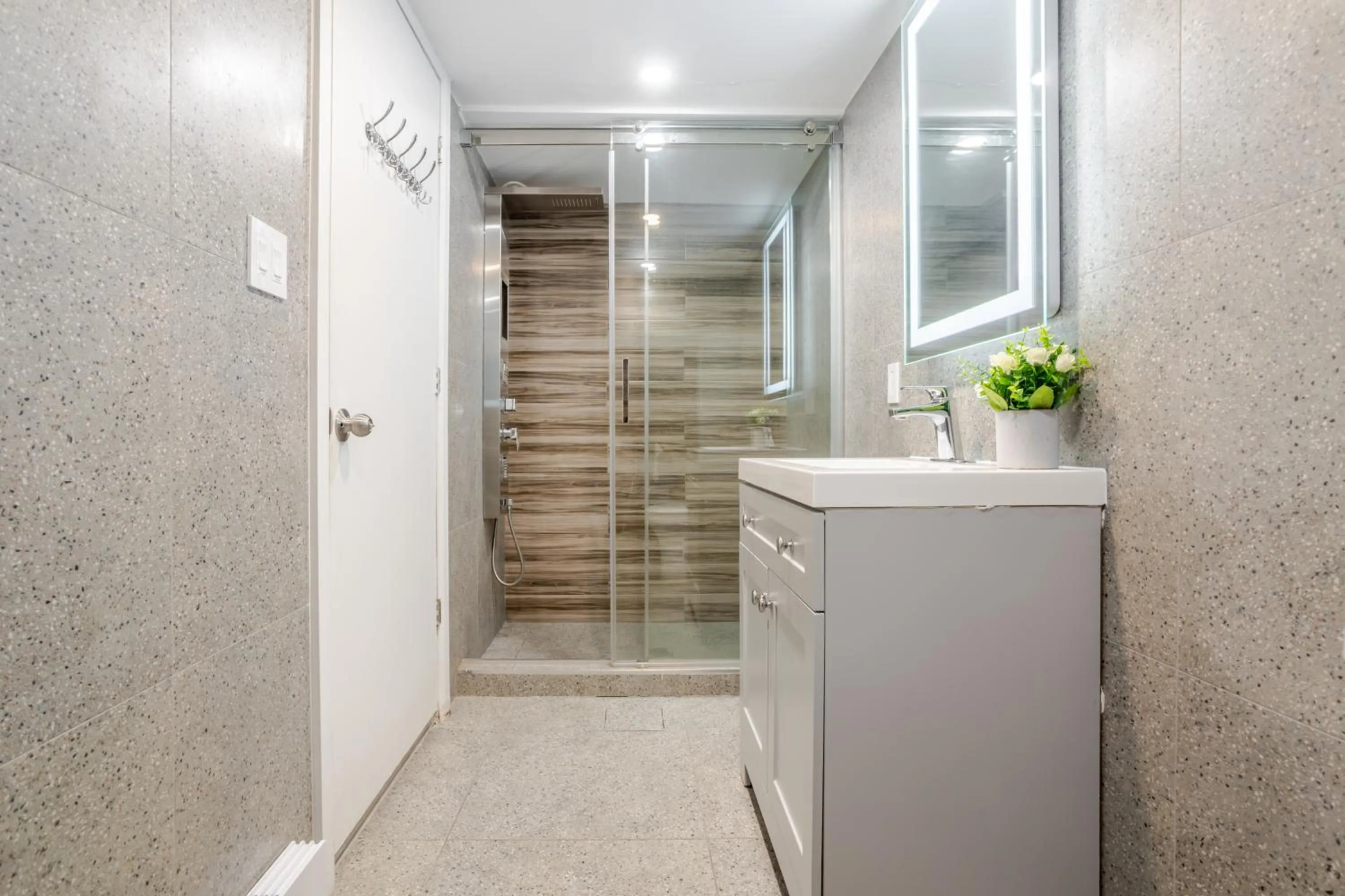 Shower in Olympia Hotel by Lodgo