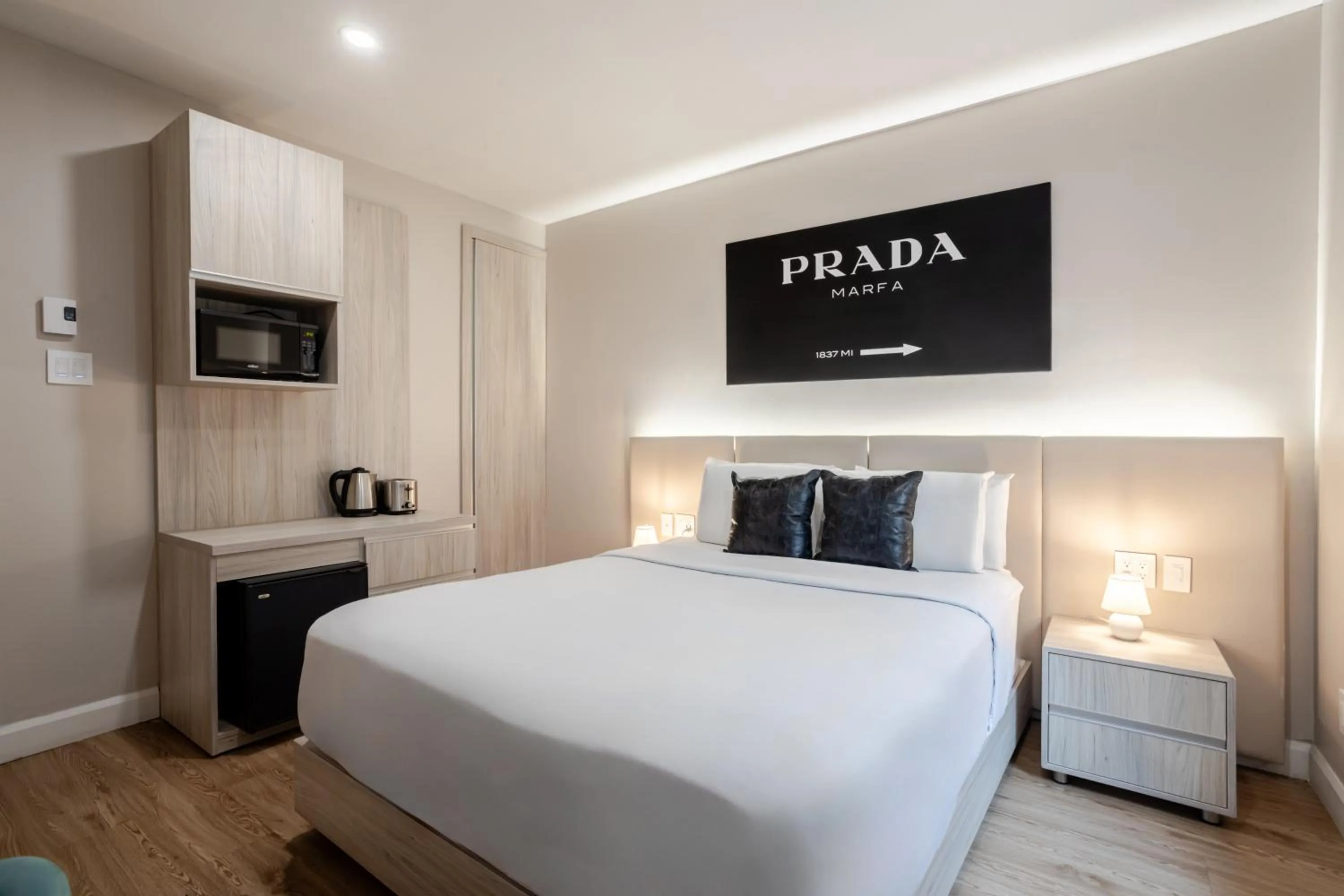 Bed in Olympia Hotel by Lodgo