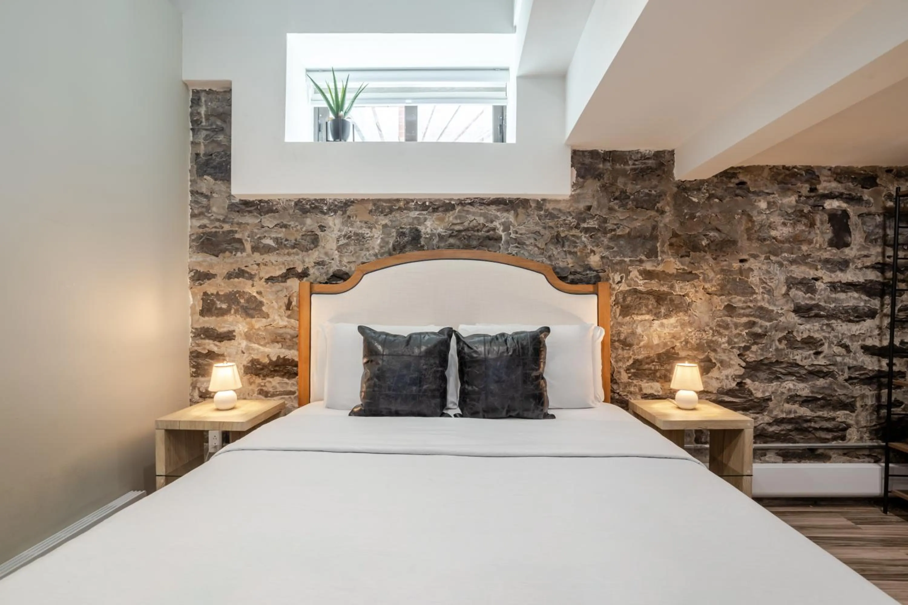 Bed in Olympia Hotel by Lodgo