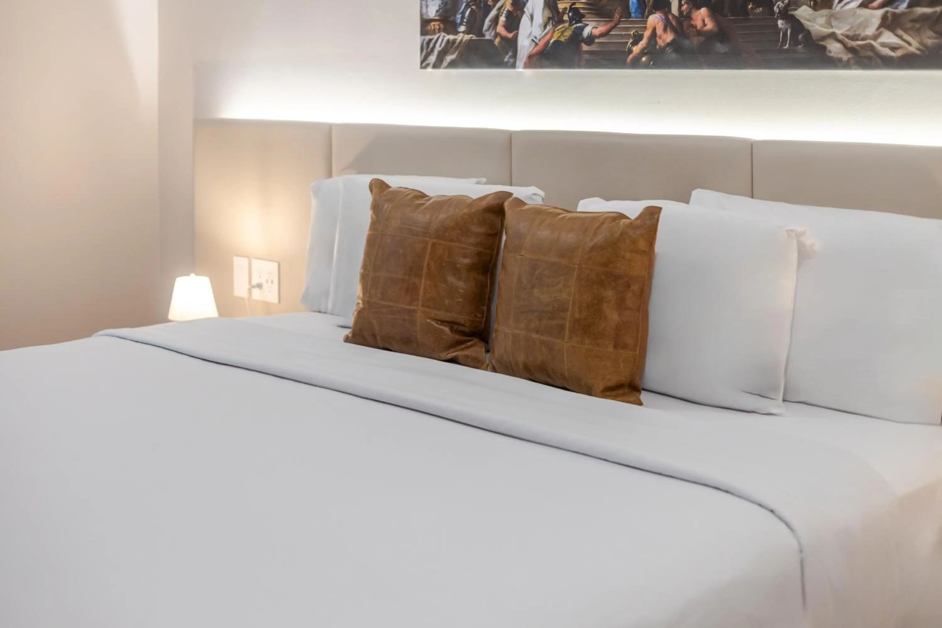 Bed in Olympia Hotel by Lodgo