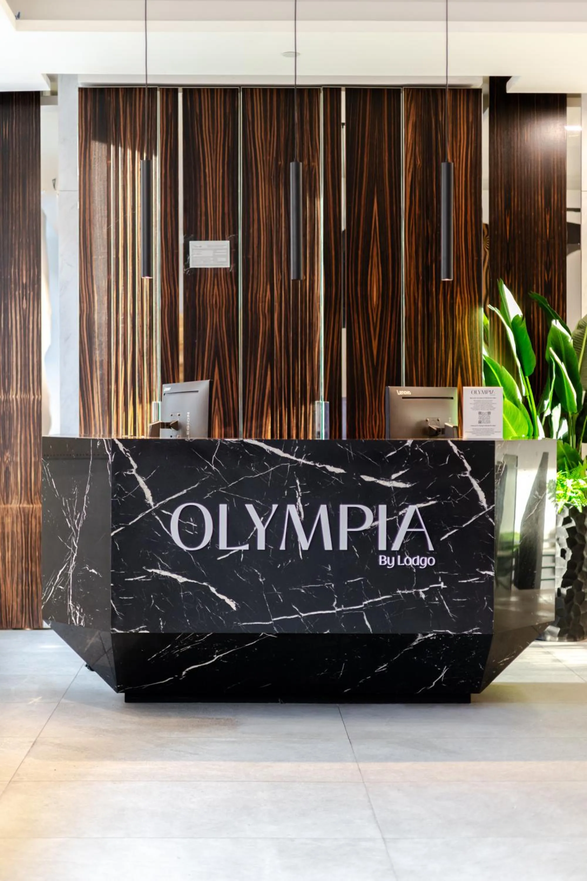 Lobby or reception in Olympia Hotel by Lodgo
