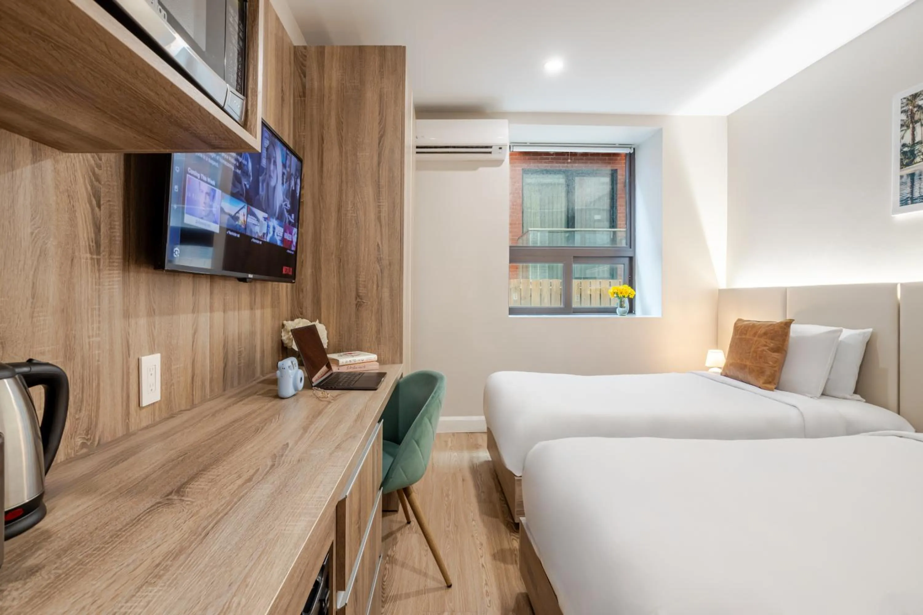 Bed in Olympia Hotel by Lodgo