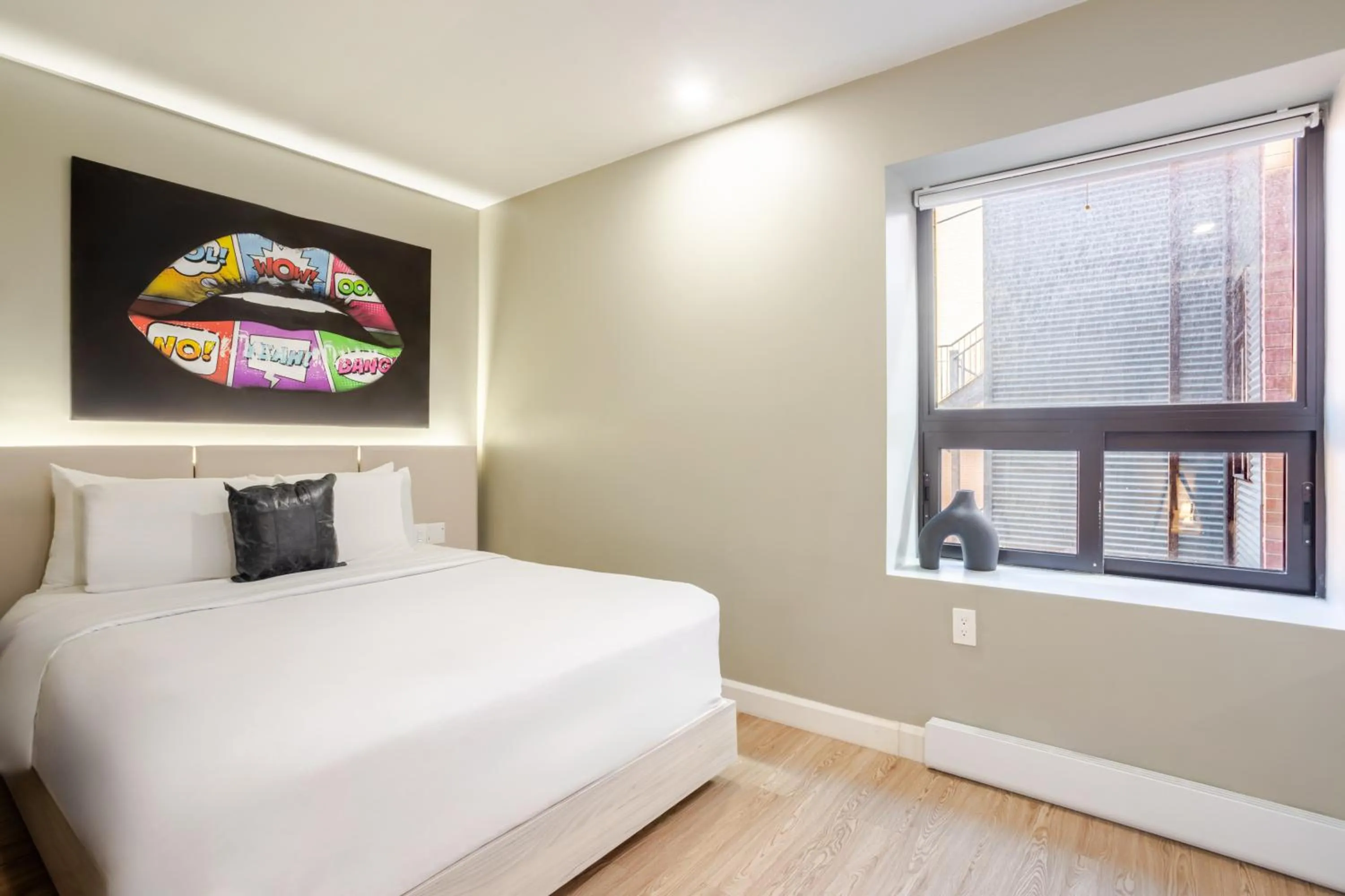 Bed in Olympia Hotel by Lodgo