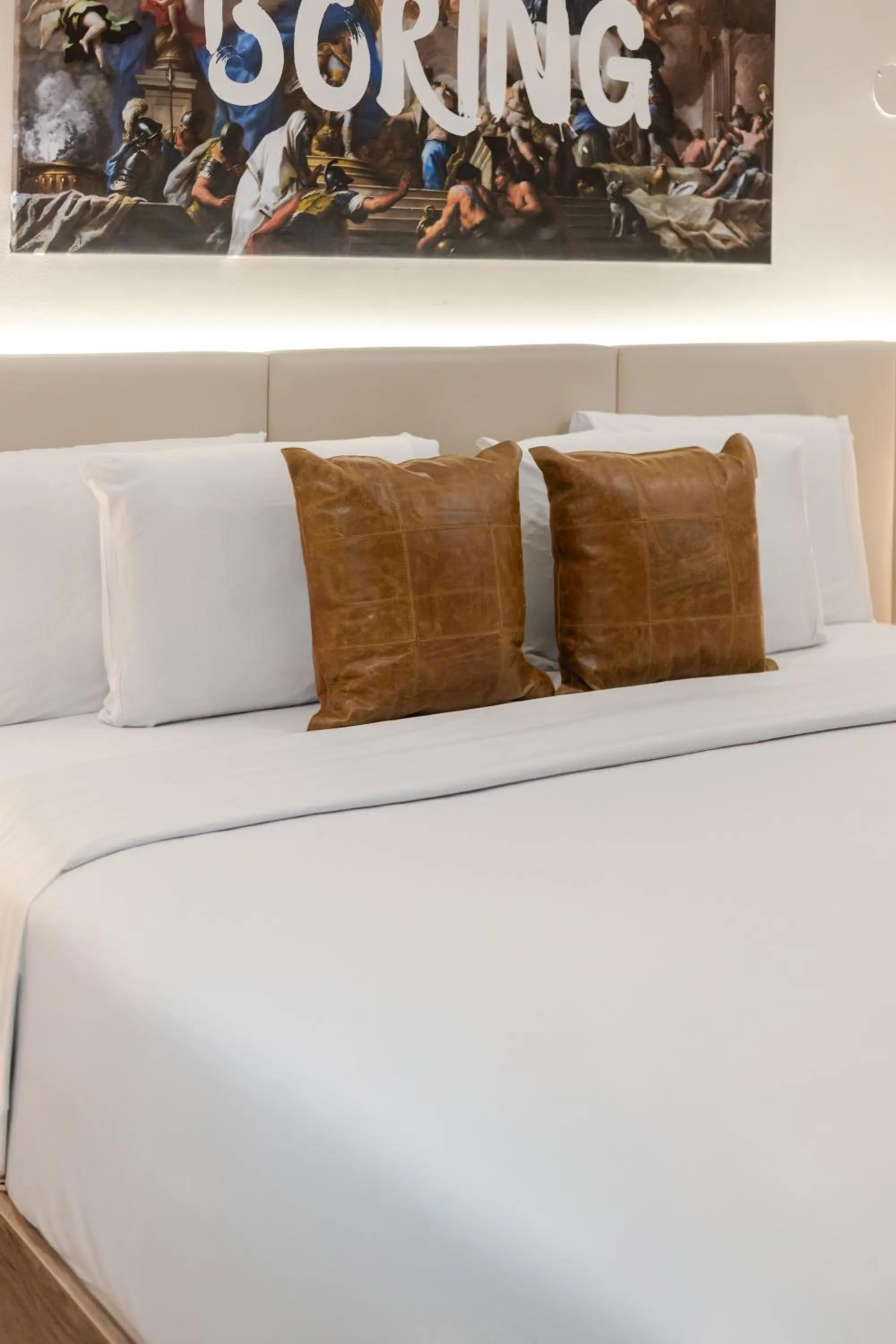 Bed in Olympia Hotel by Lodgo