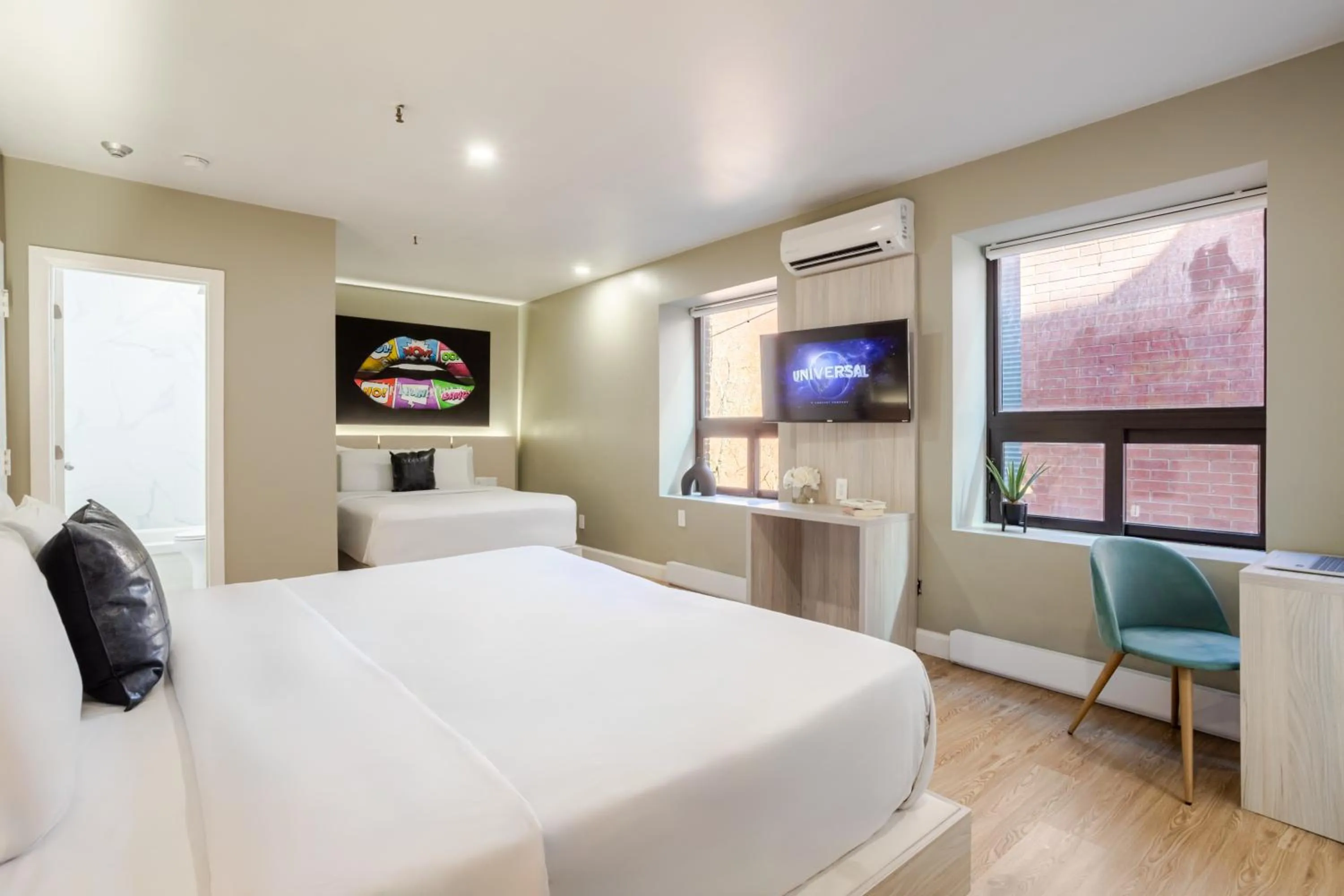 Bed in Olympia Hotel by Lodgo