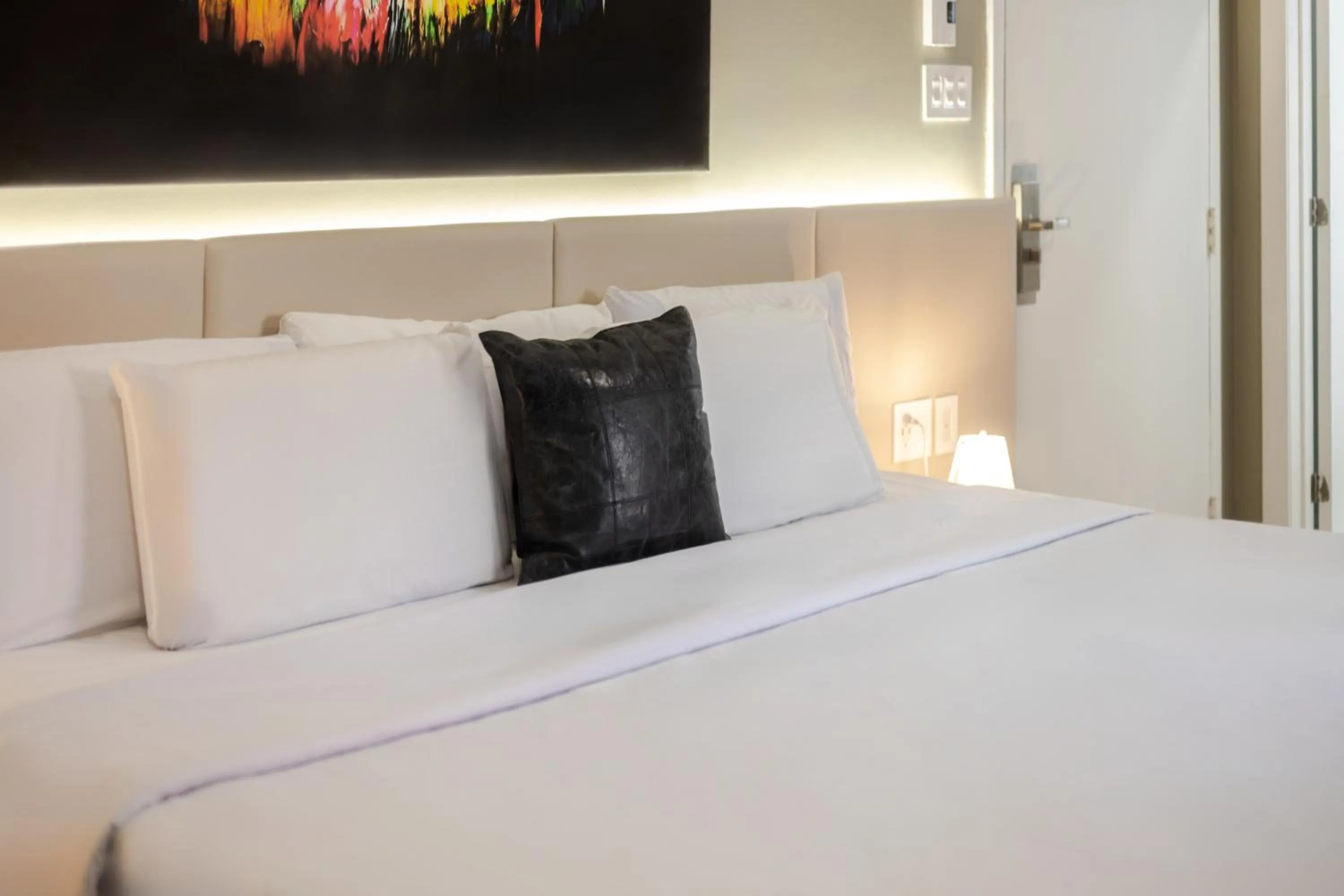 Bed in Olympia Hotel by Lodgo