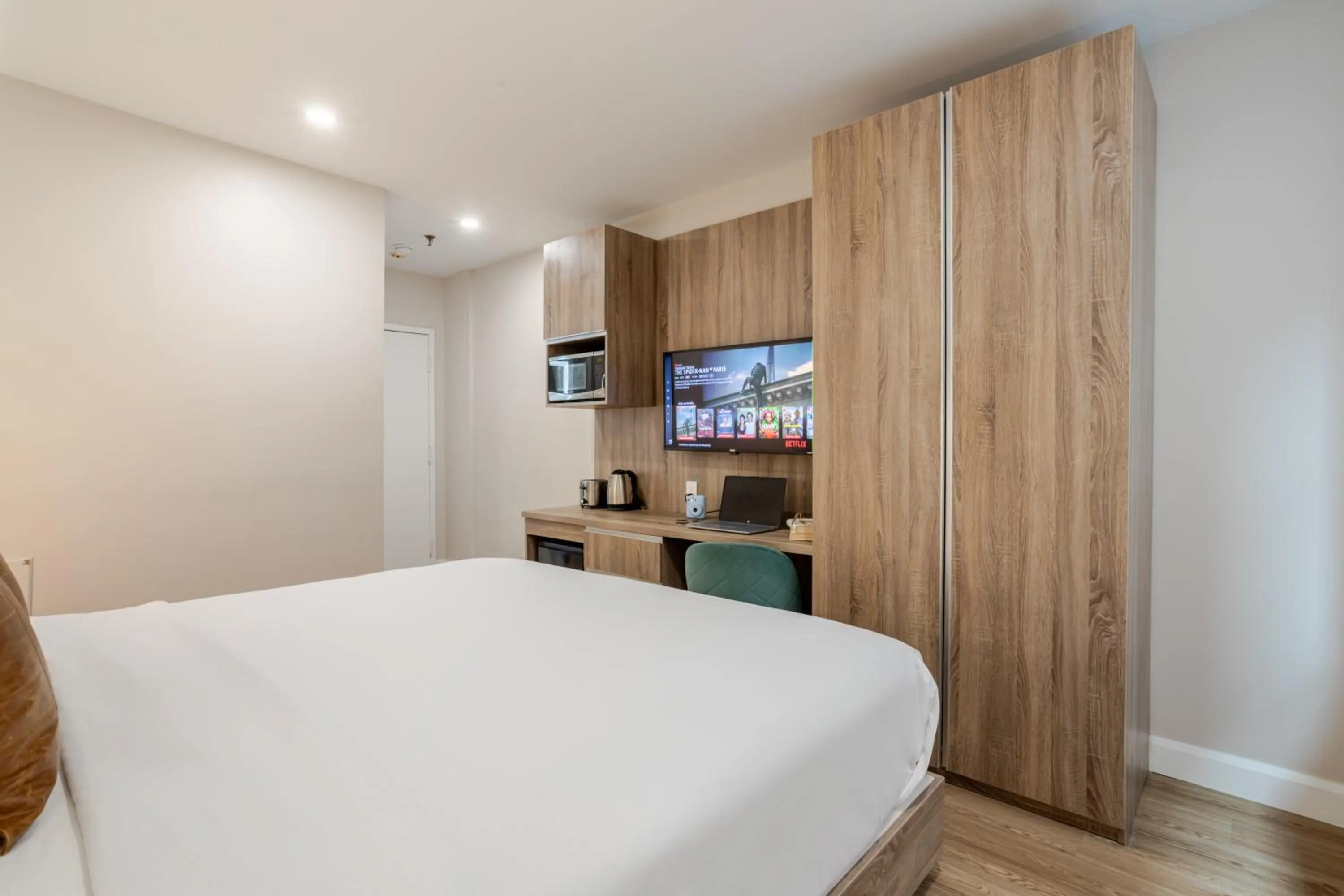 Bed in Olympia Hotel by Lodgo