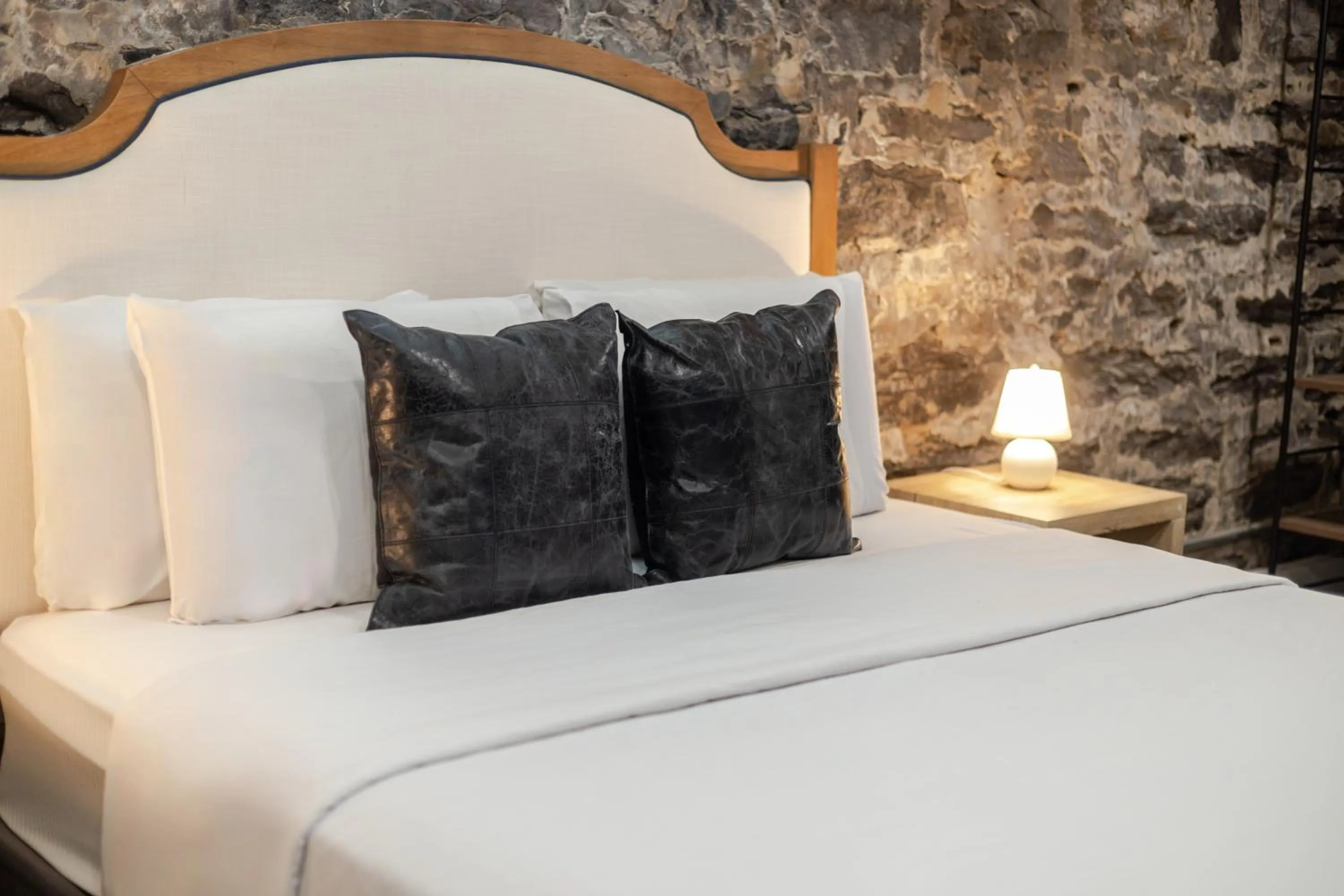 Bed in Olympia Hotel by Lodgo