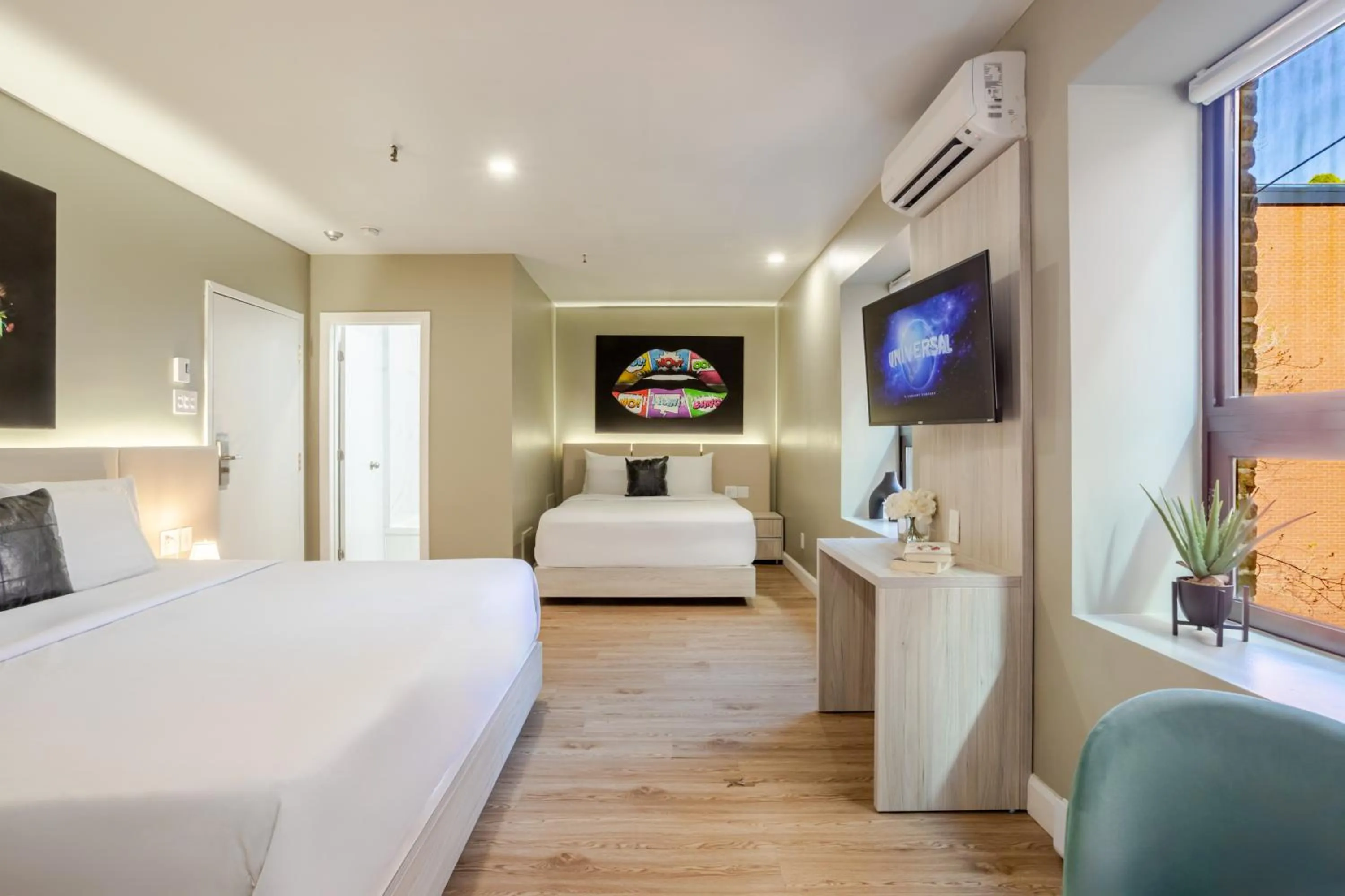 Bed in Olympia Hotel by Lodgo