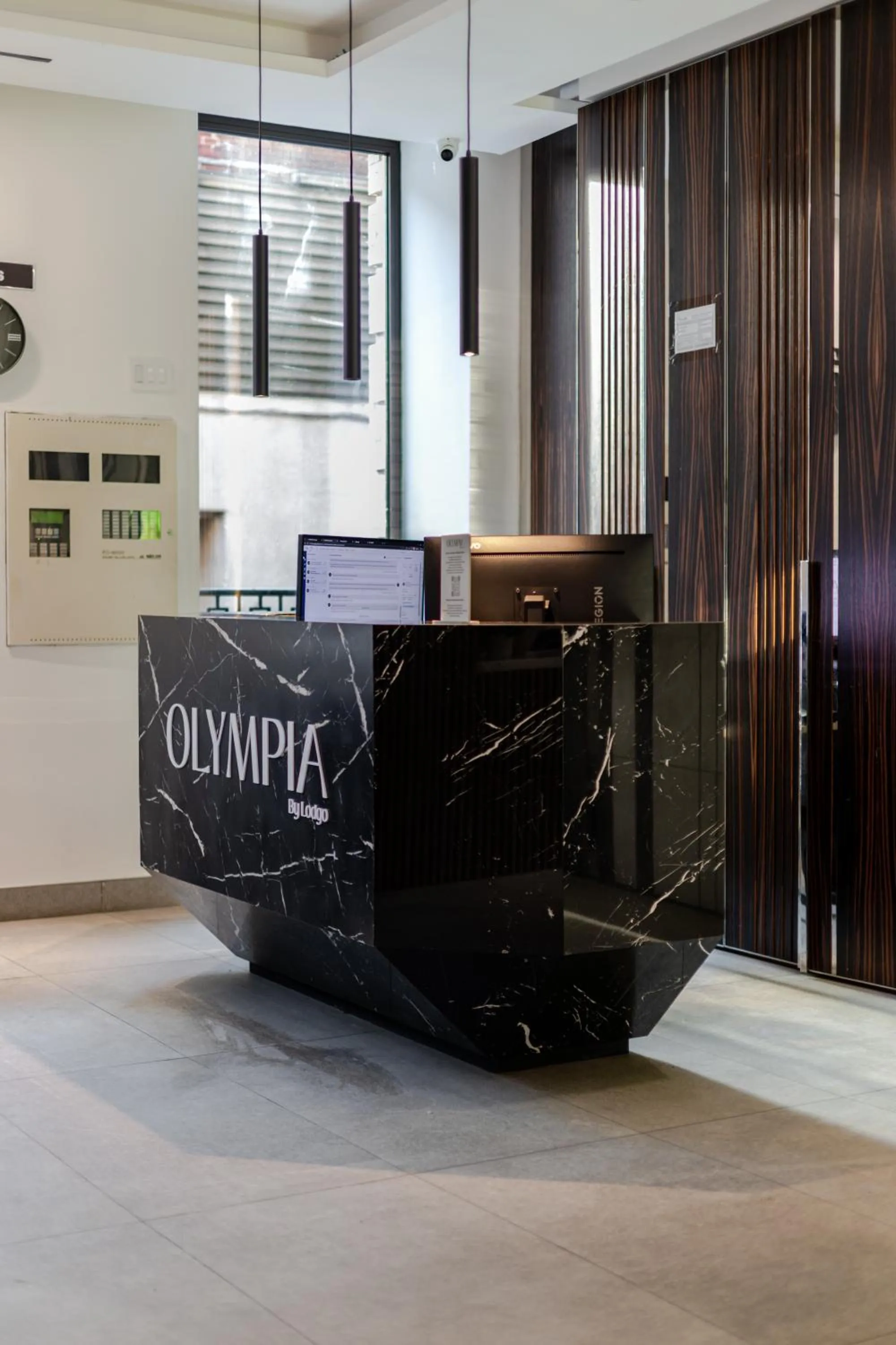 Lobby or reception in Olympia Hotel by Lodgo