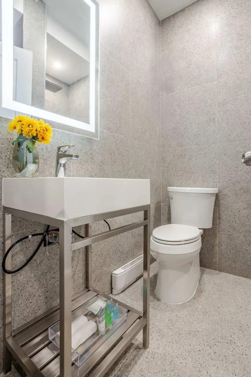 Toilet in Olympia Hotel by Lodgo