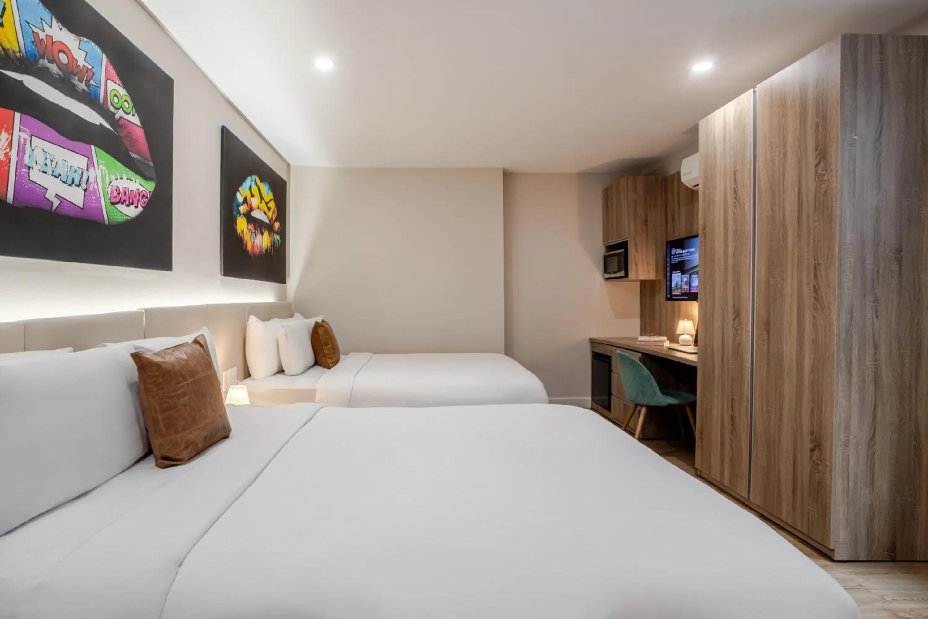 Bed in Olympia Hotel by Lodgo