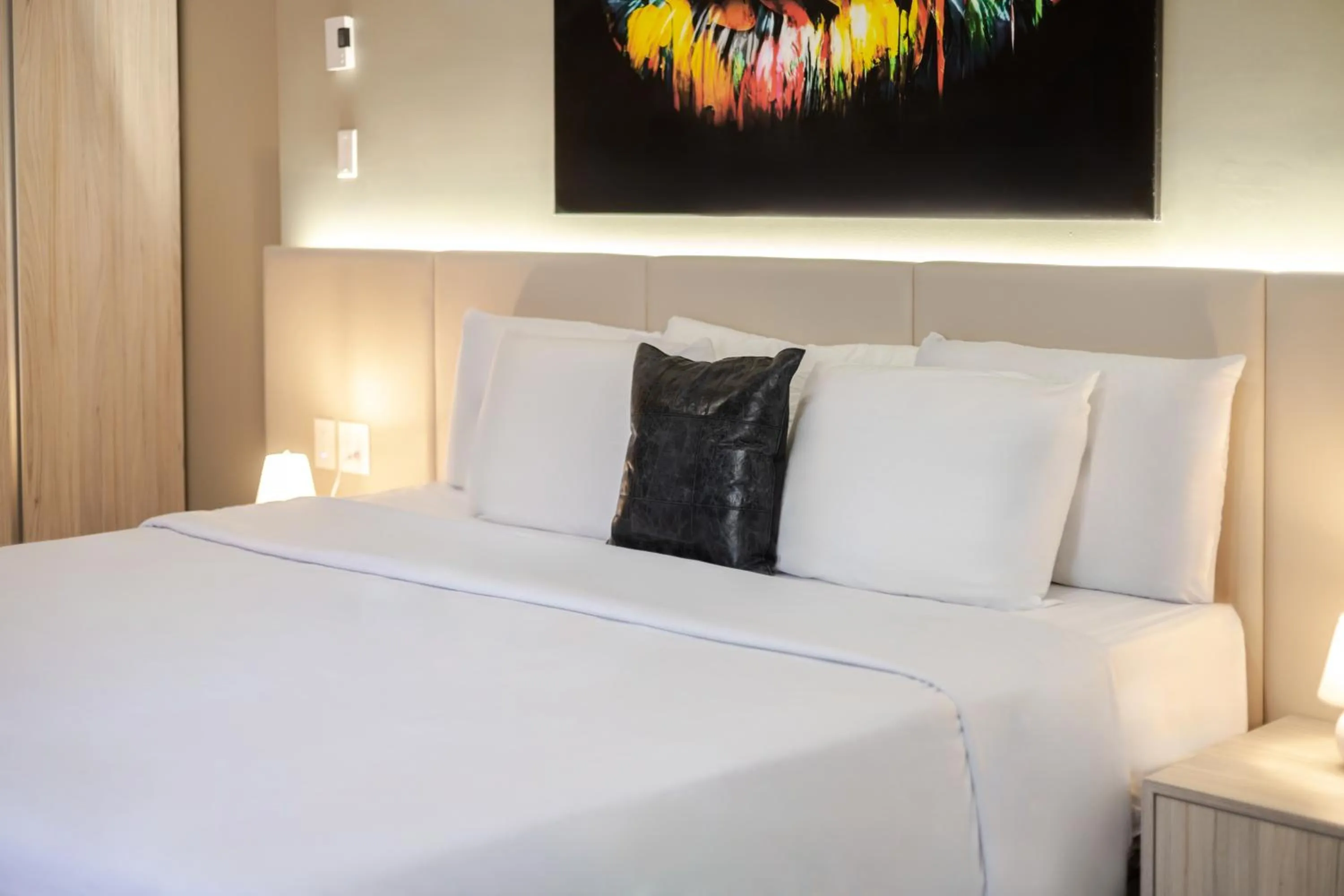 Bed in Olympia Hotel by Lodgo