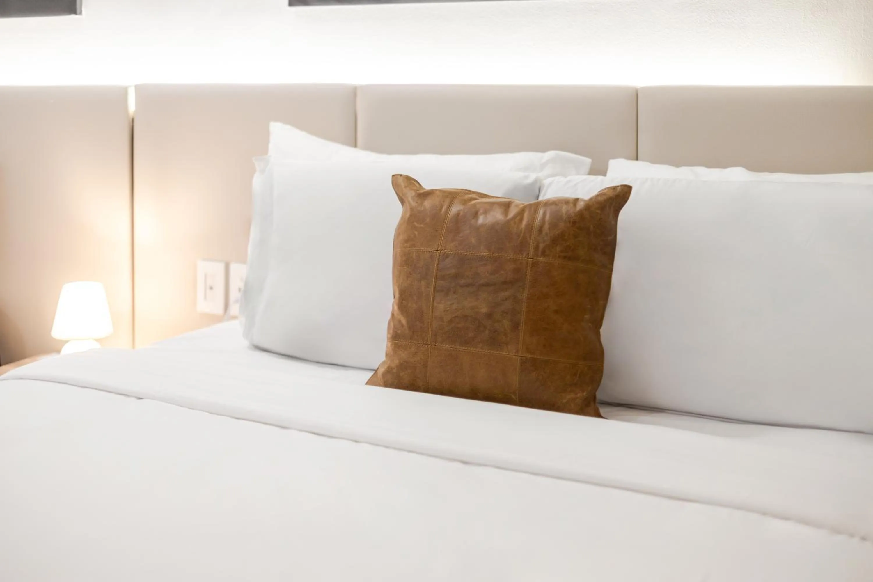 Bed in Olympia Hotel by Lodgo