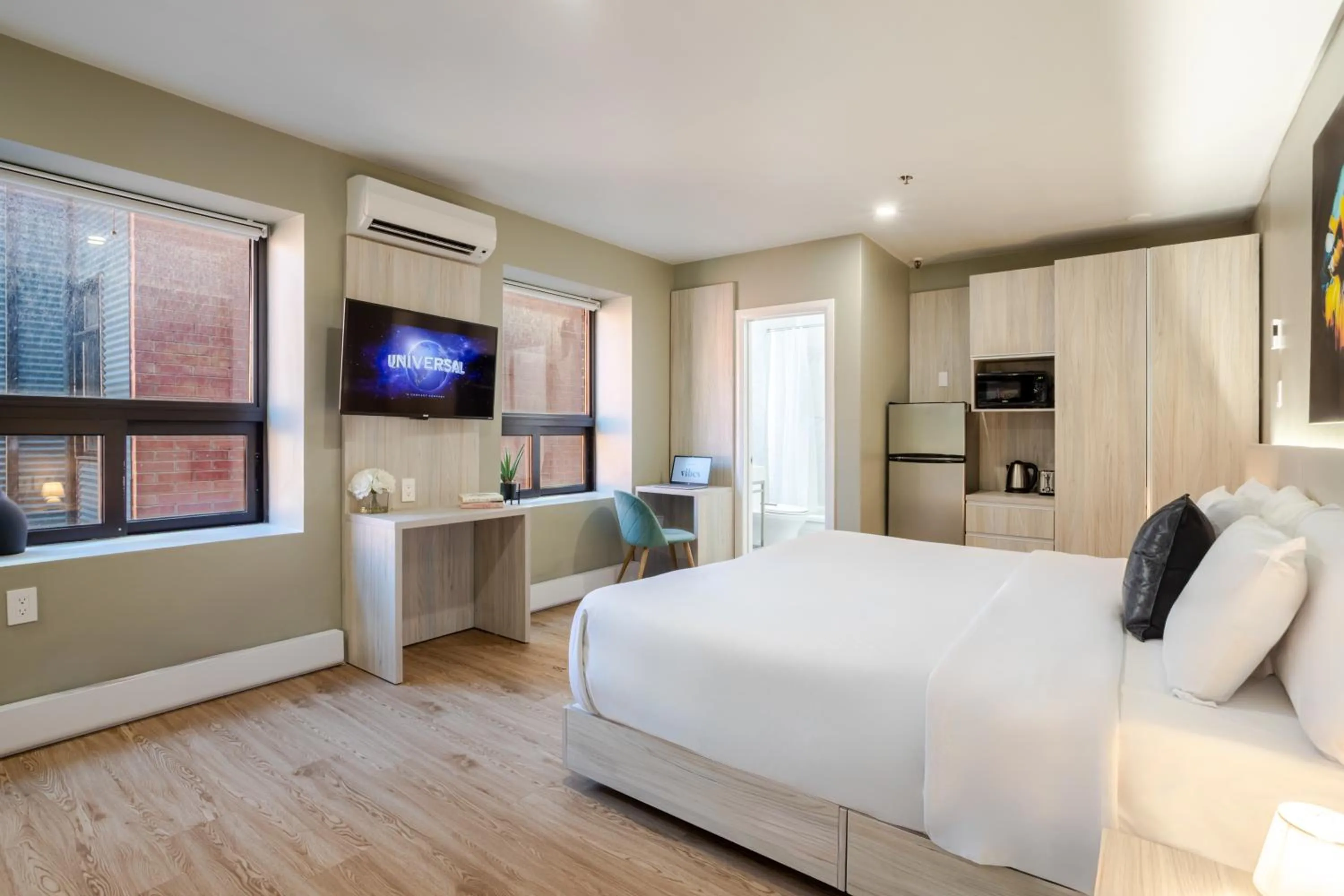 Bed in Olympia Hotel by Lodgo