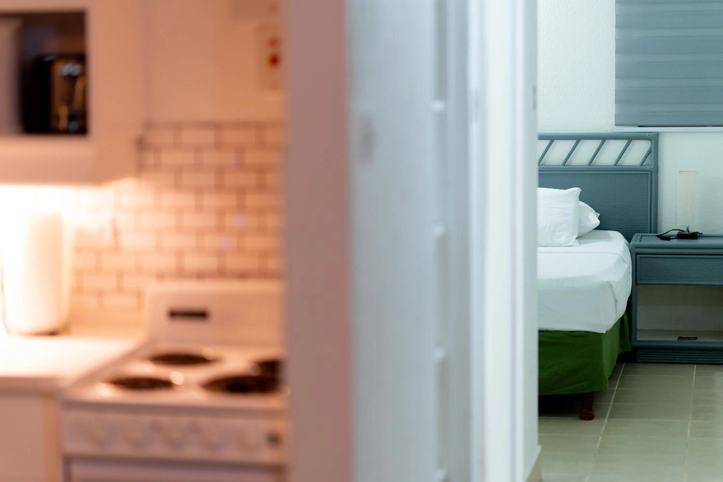 Bed in Sunset Lane Apartment Hotel