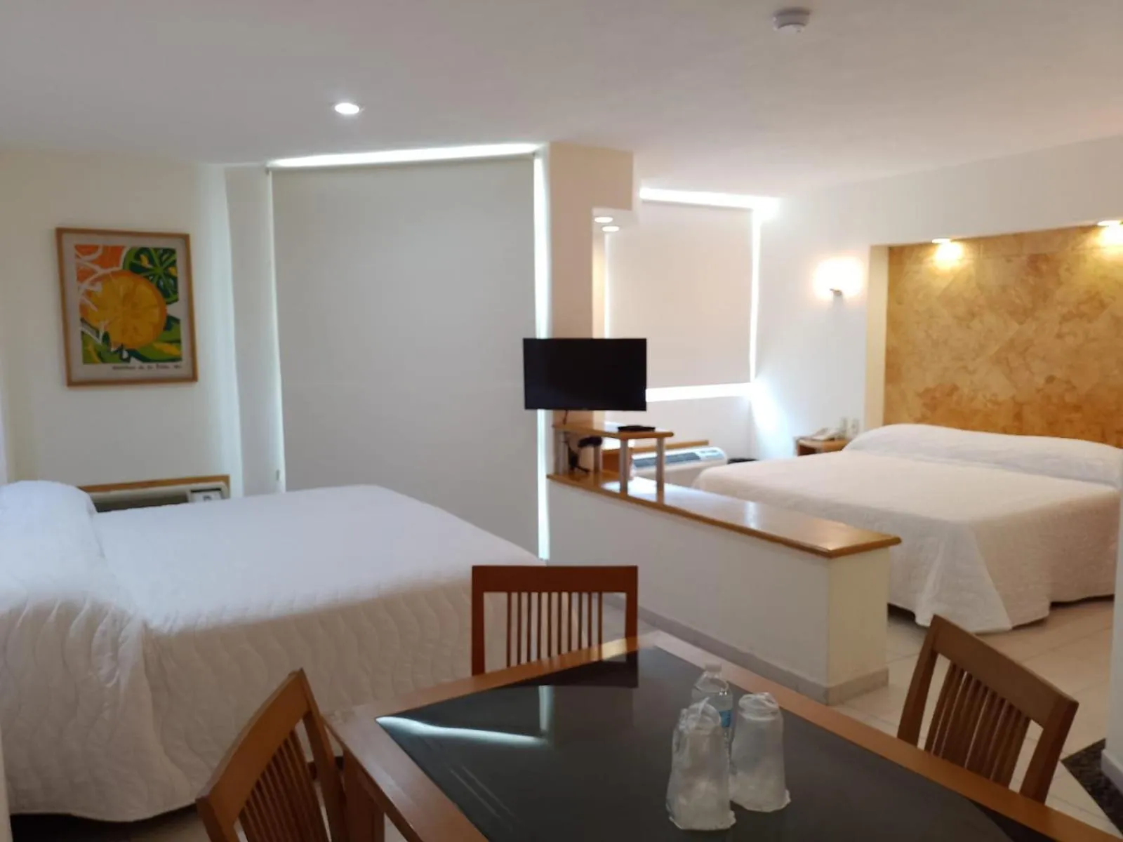 Bed in Angeles Suites & Hotel