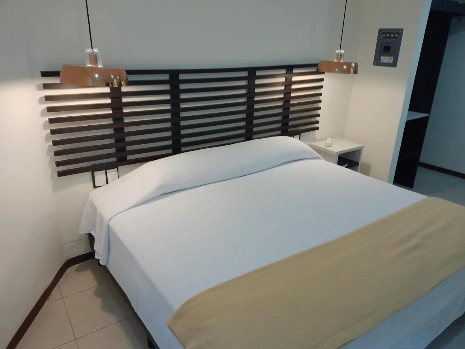 Bed in Angeles Suites & Hotel