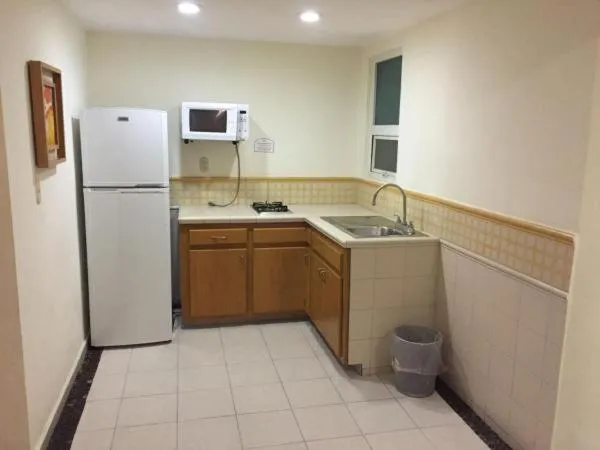 Kitchen or kitchenette in Angeles Suites & Hotel