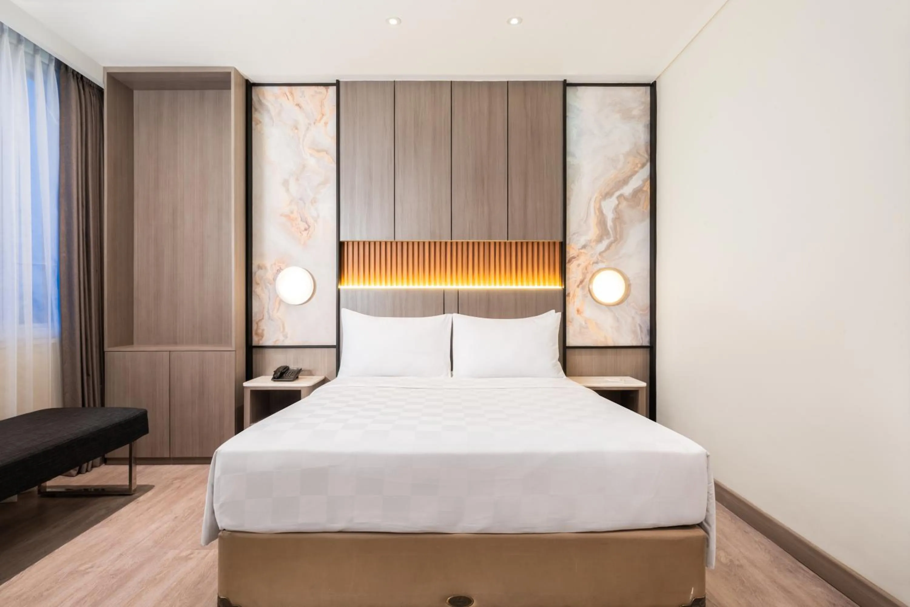 Bed in Zest Jemursari by Swiss-Belhotel International