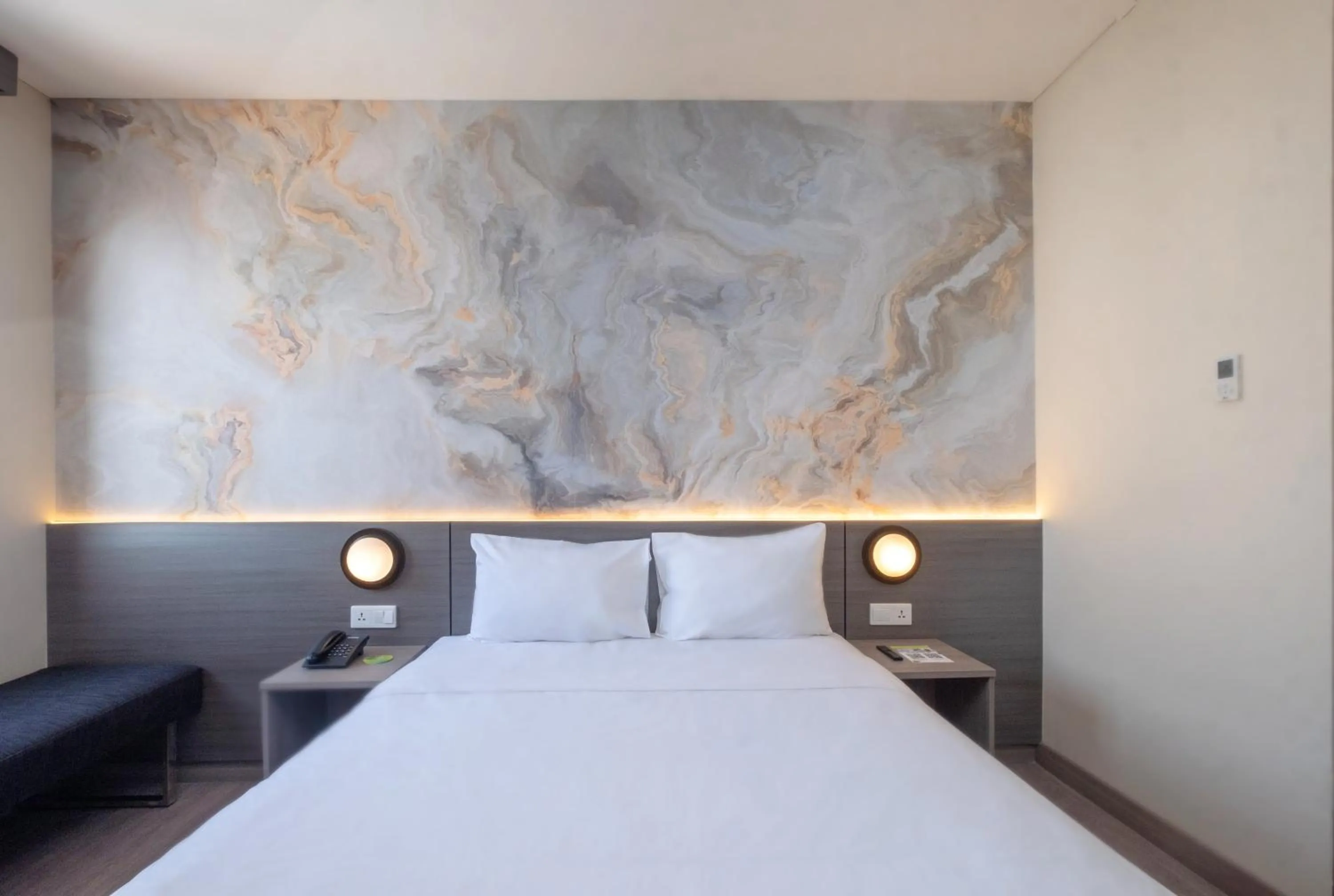 Bed in Zest Jemursari by Swiss-Belhotel International