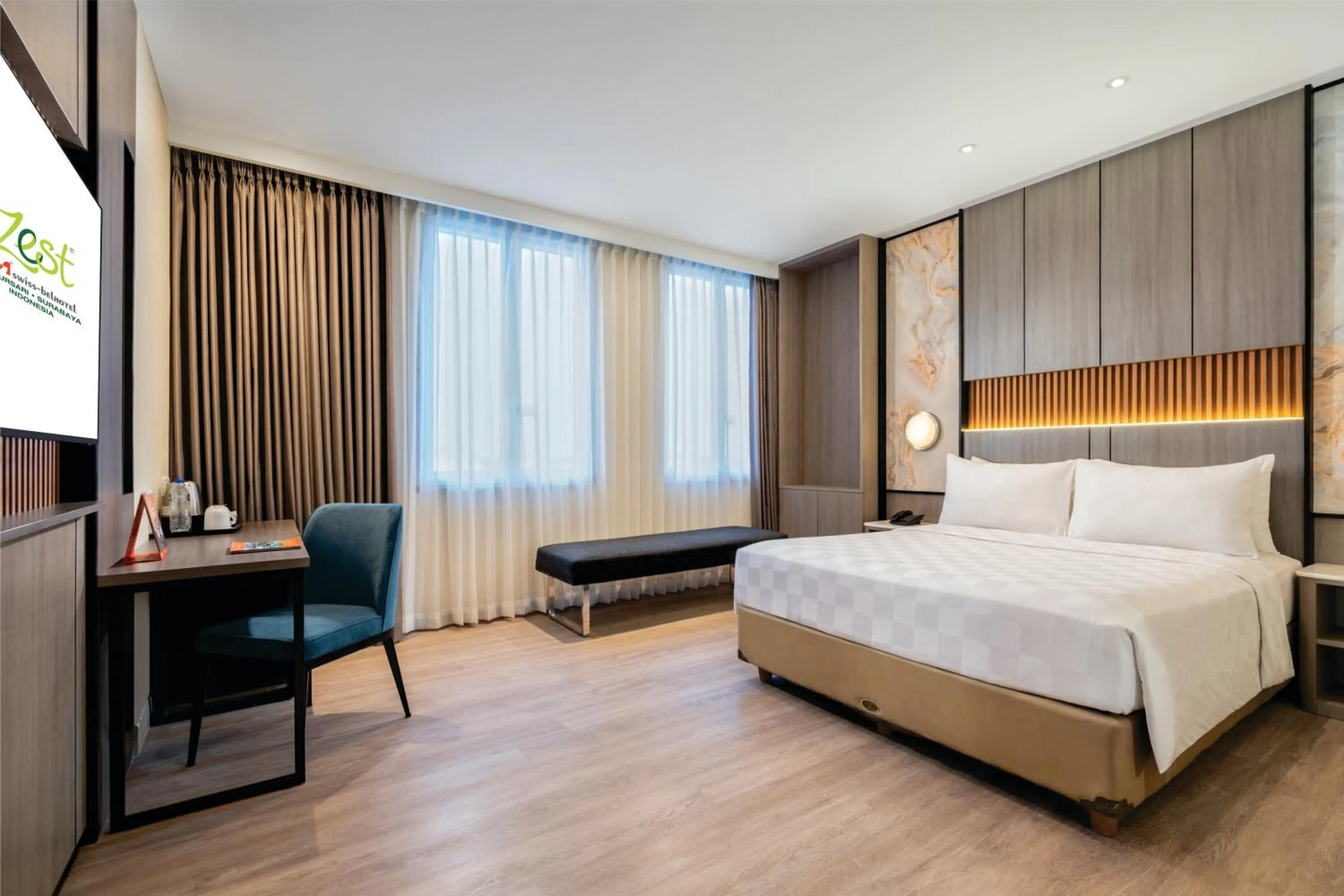 Bed in Zest Jemursari by Swiss-Belhotel International