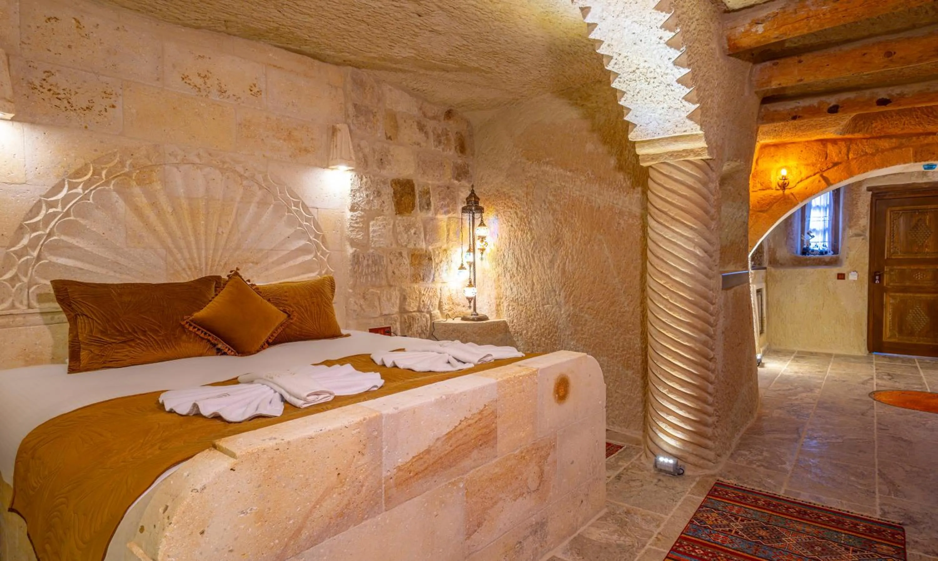 Bed in Lagoon Cave Suites