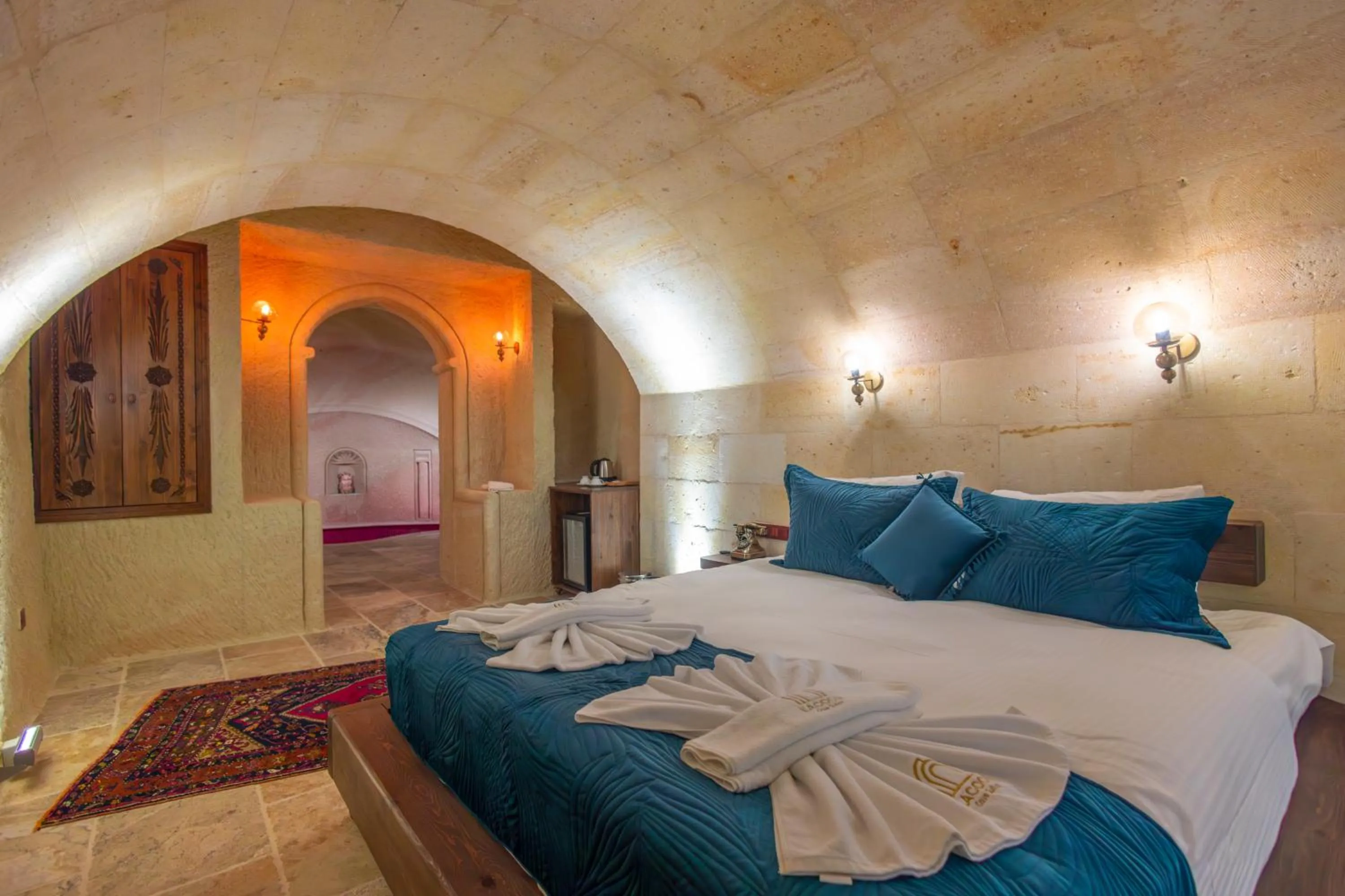 Bed in Lagoon Cave Suites