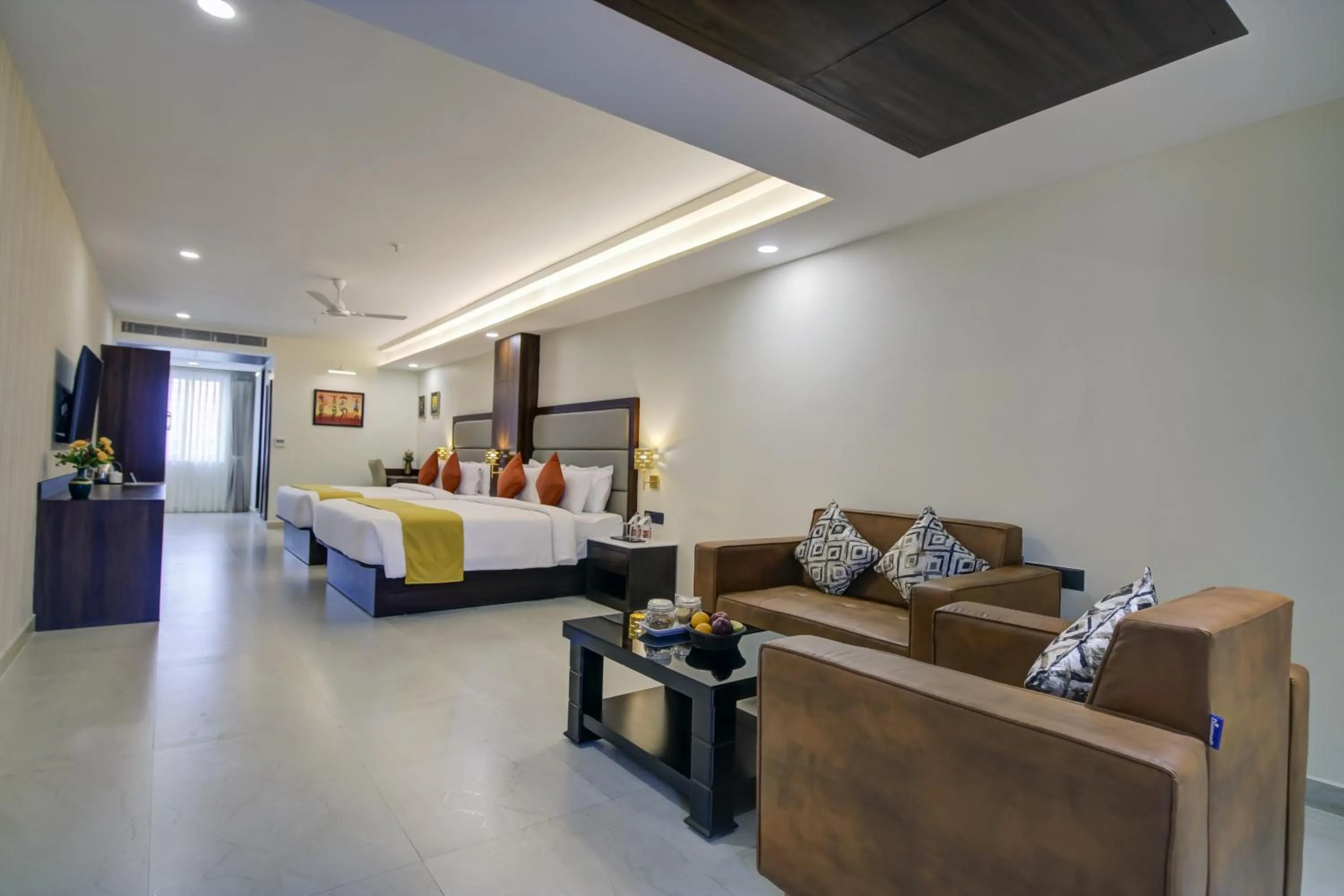 Seating area, Bed in The Bindal Hotel