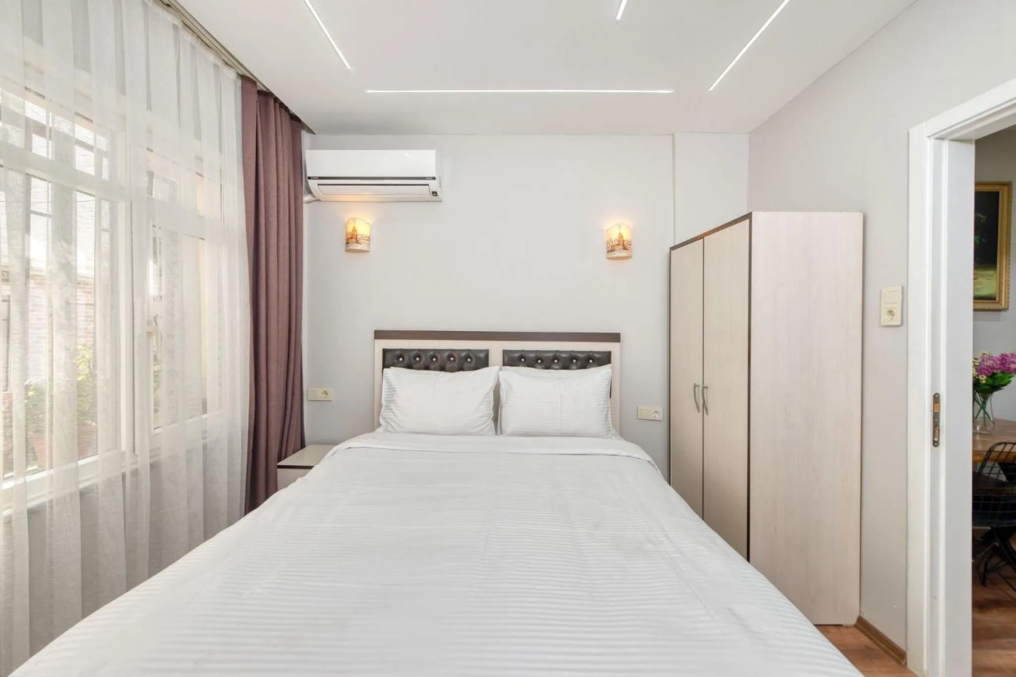 Four-Bedroom Apartment with Balcony  in Bright Apart Hotel