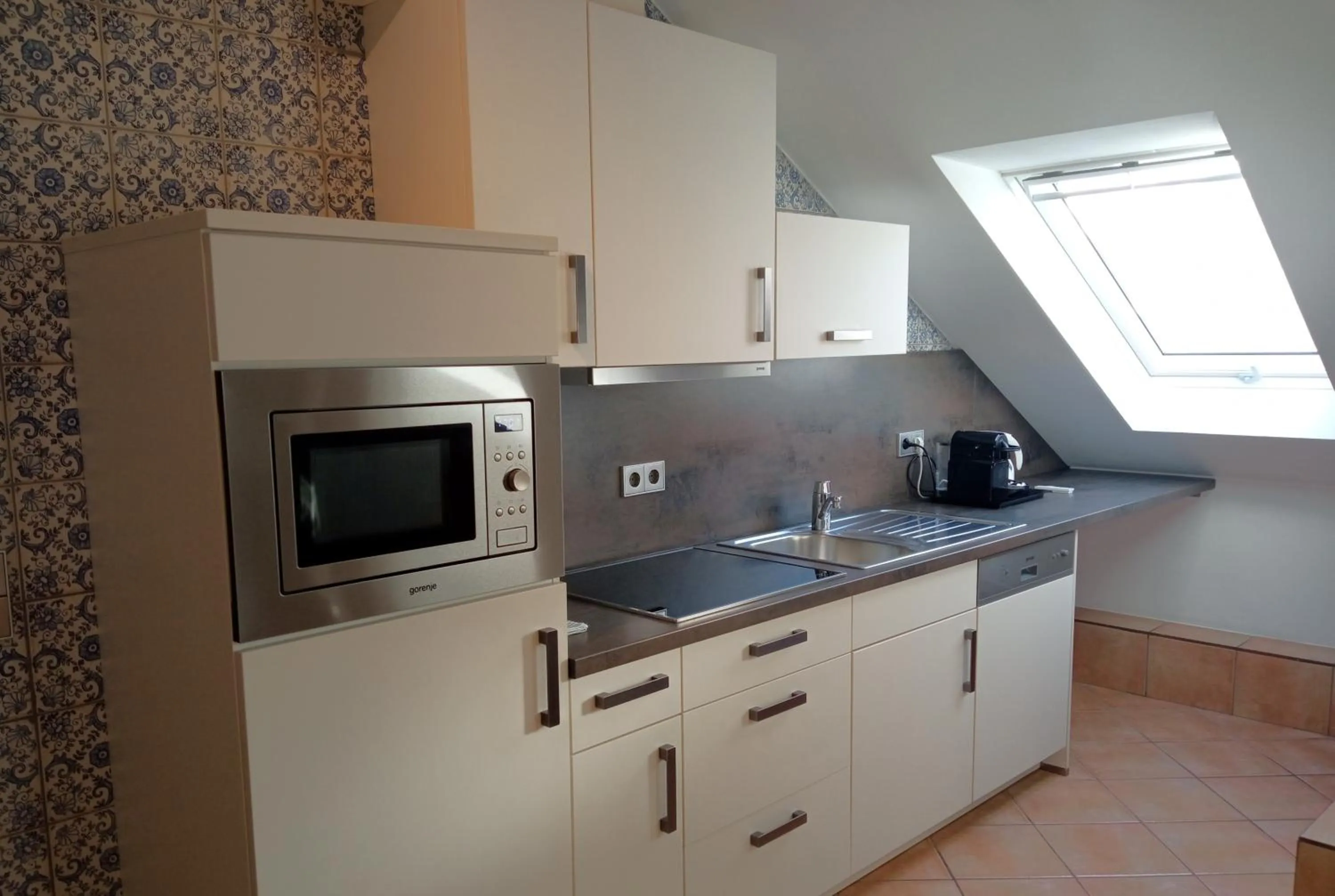 Kitchen or kitchenette in Appart-Hotel Gwendy