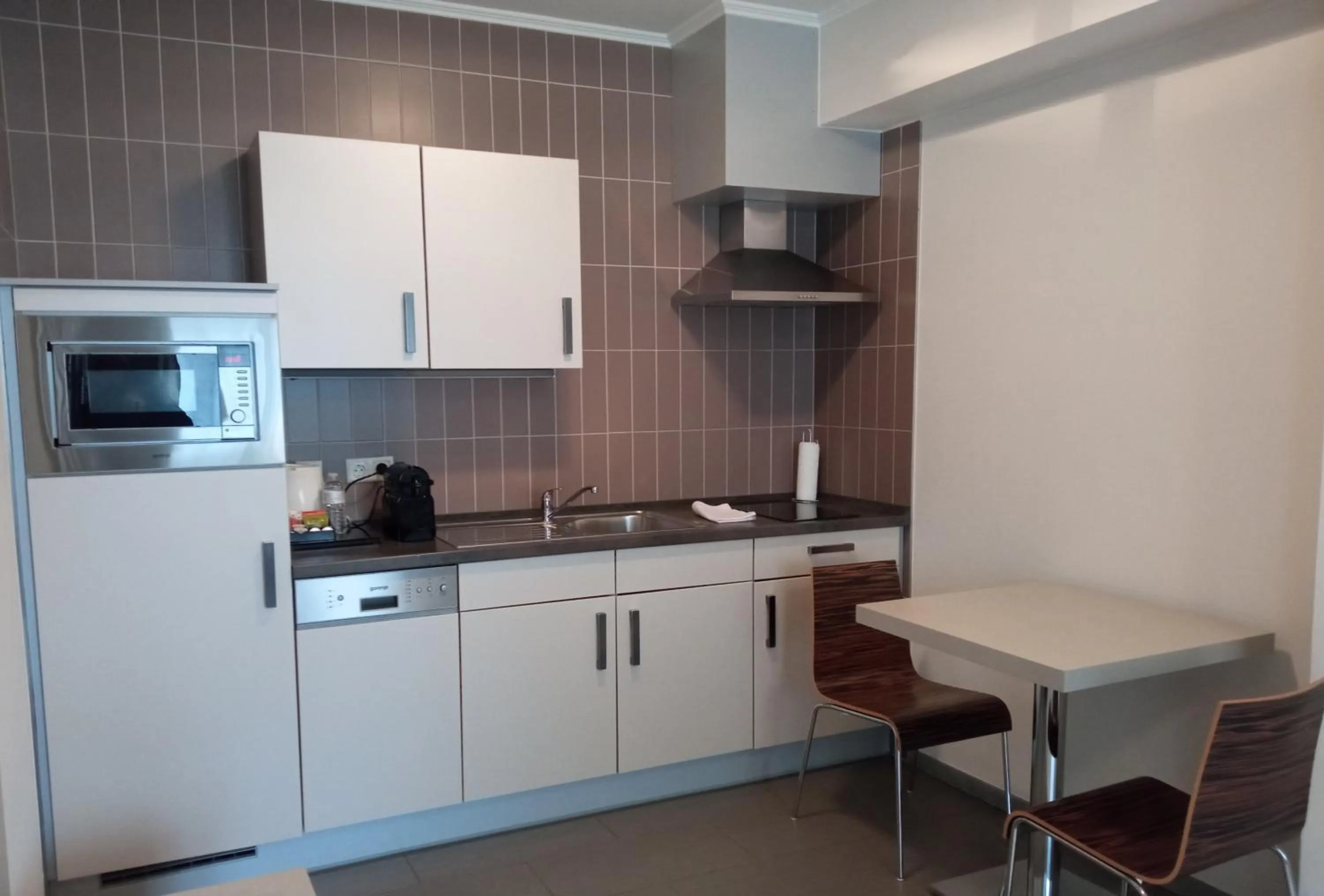 Kitchen or kitchenette in Appart-Hotel Gwendy