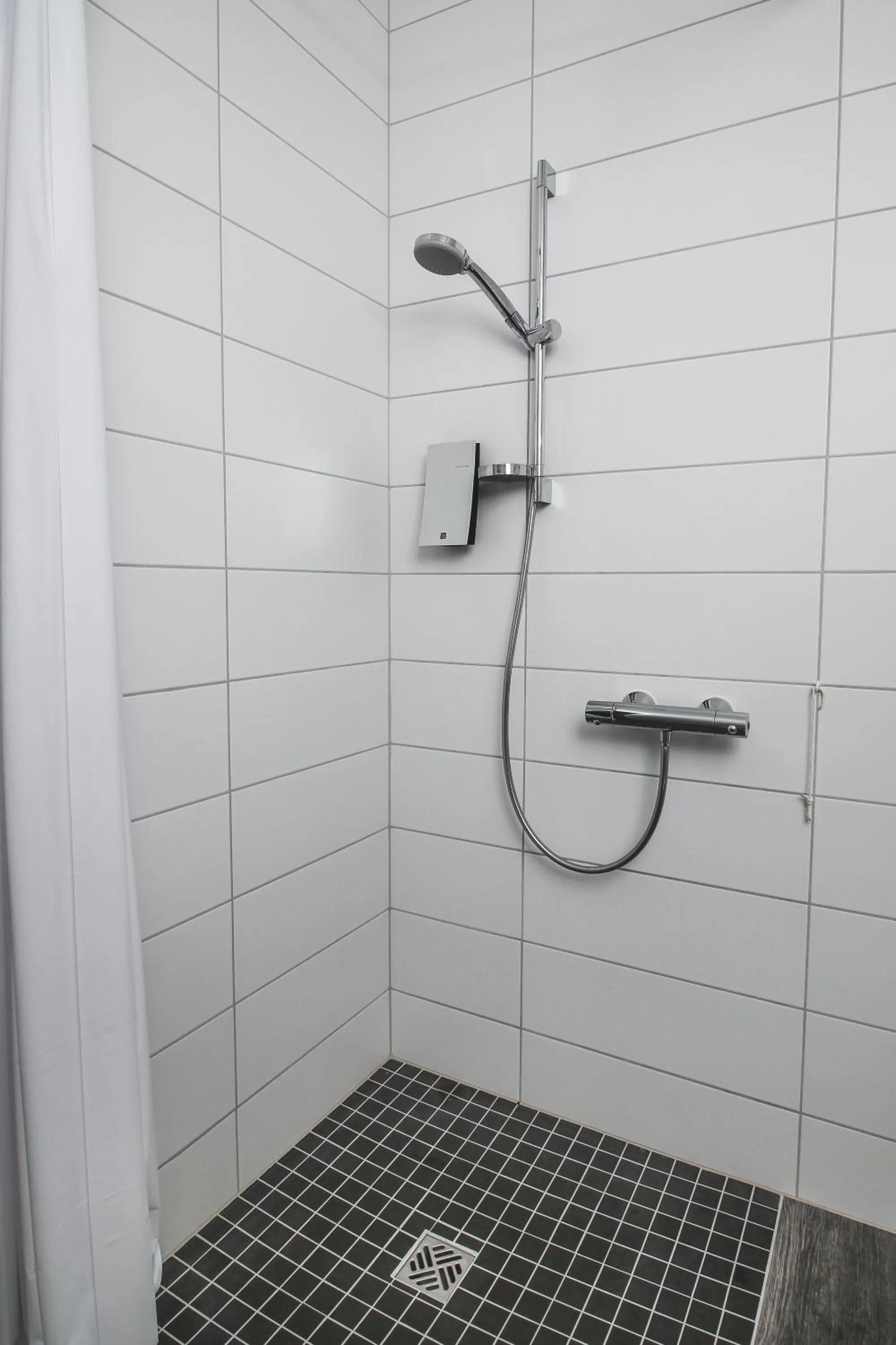 Bathroom in Bella Apartments & Rooms