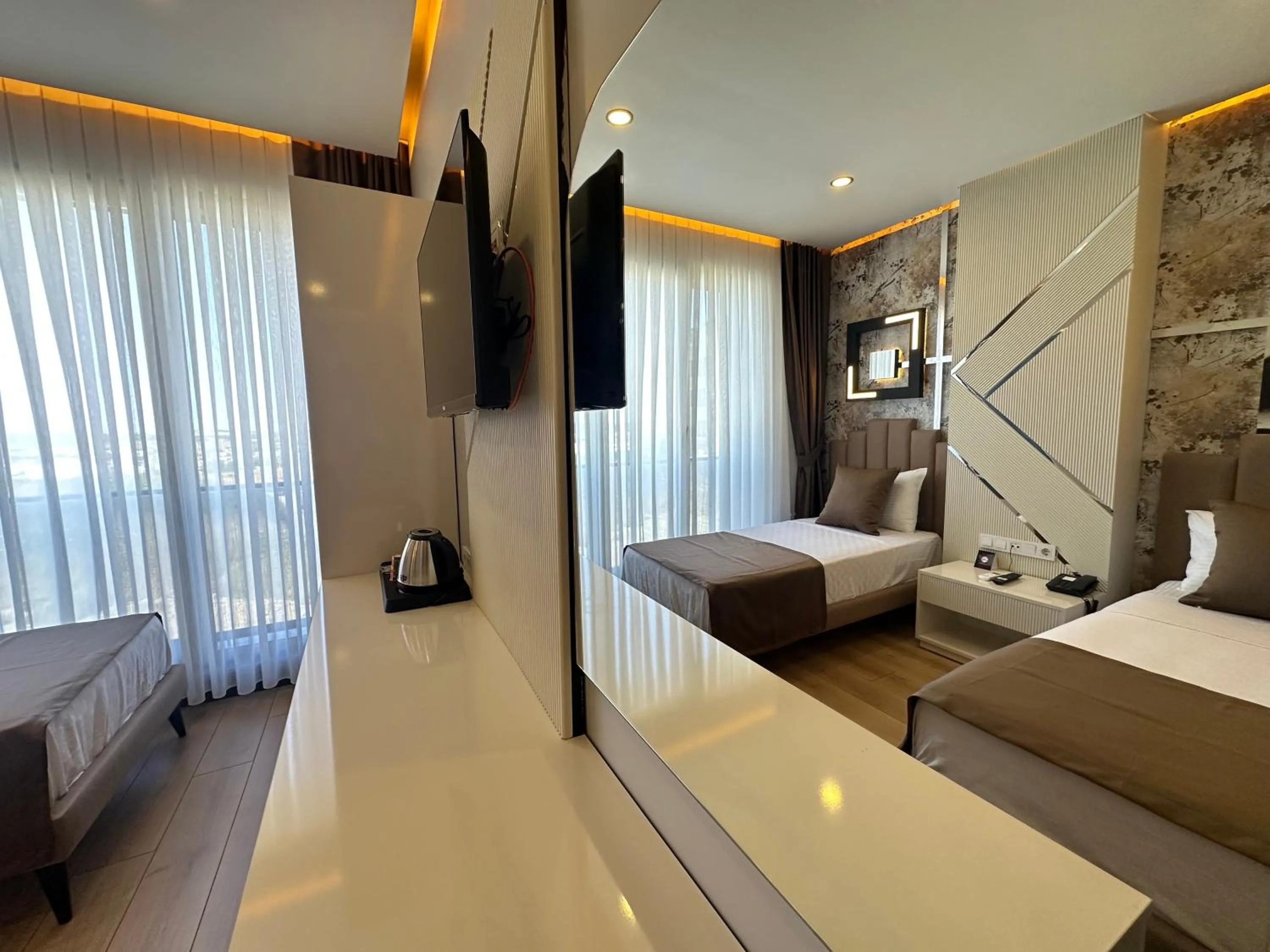 Photo of the whole room, Bed in Fourpoints Airport Hotel