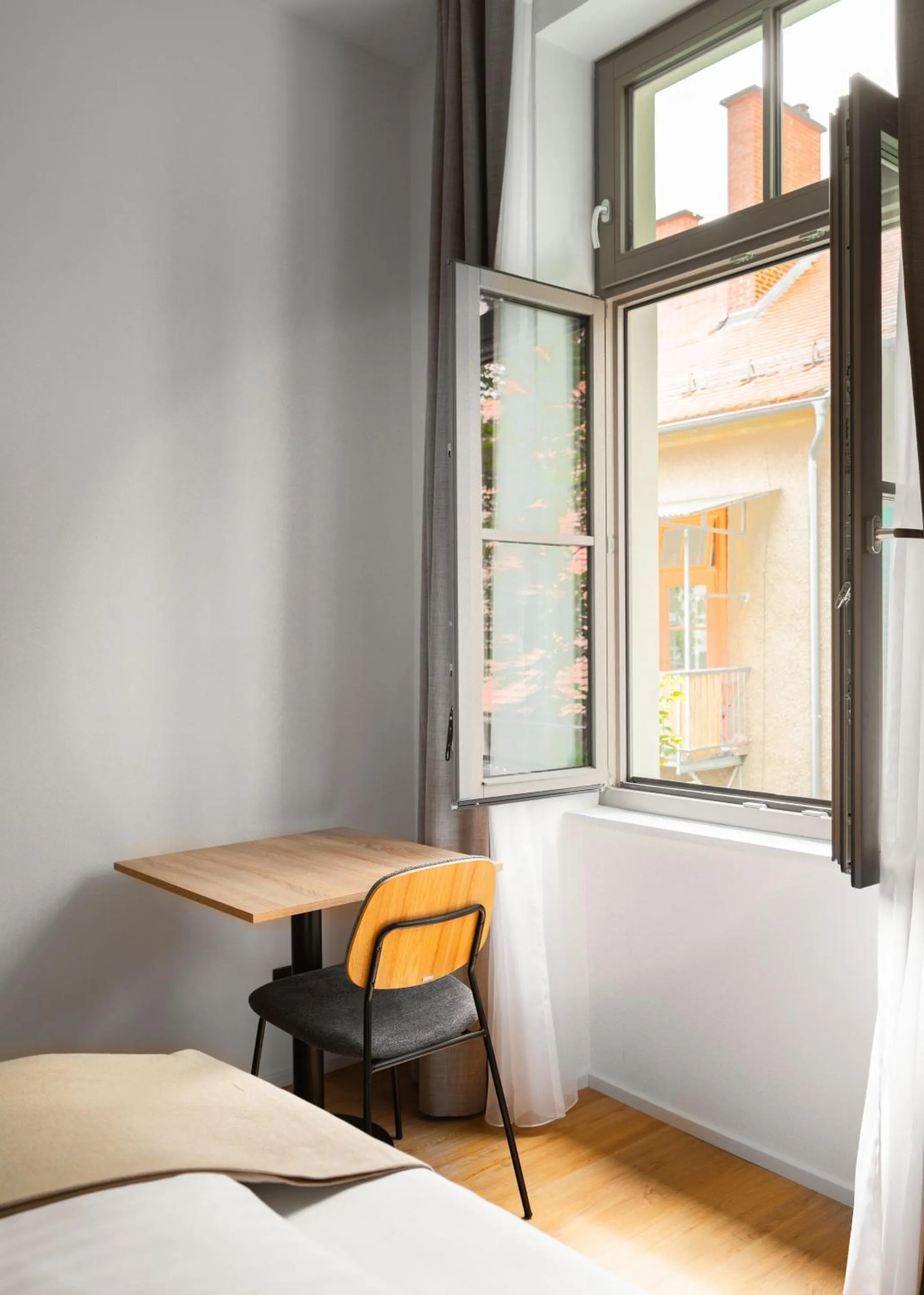 Dining area, Bed in Limehome Graz Trauttmansdorffgasse