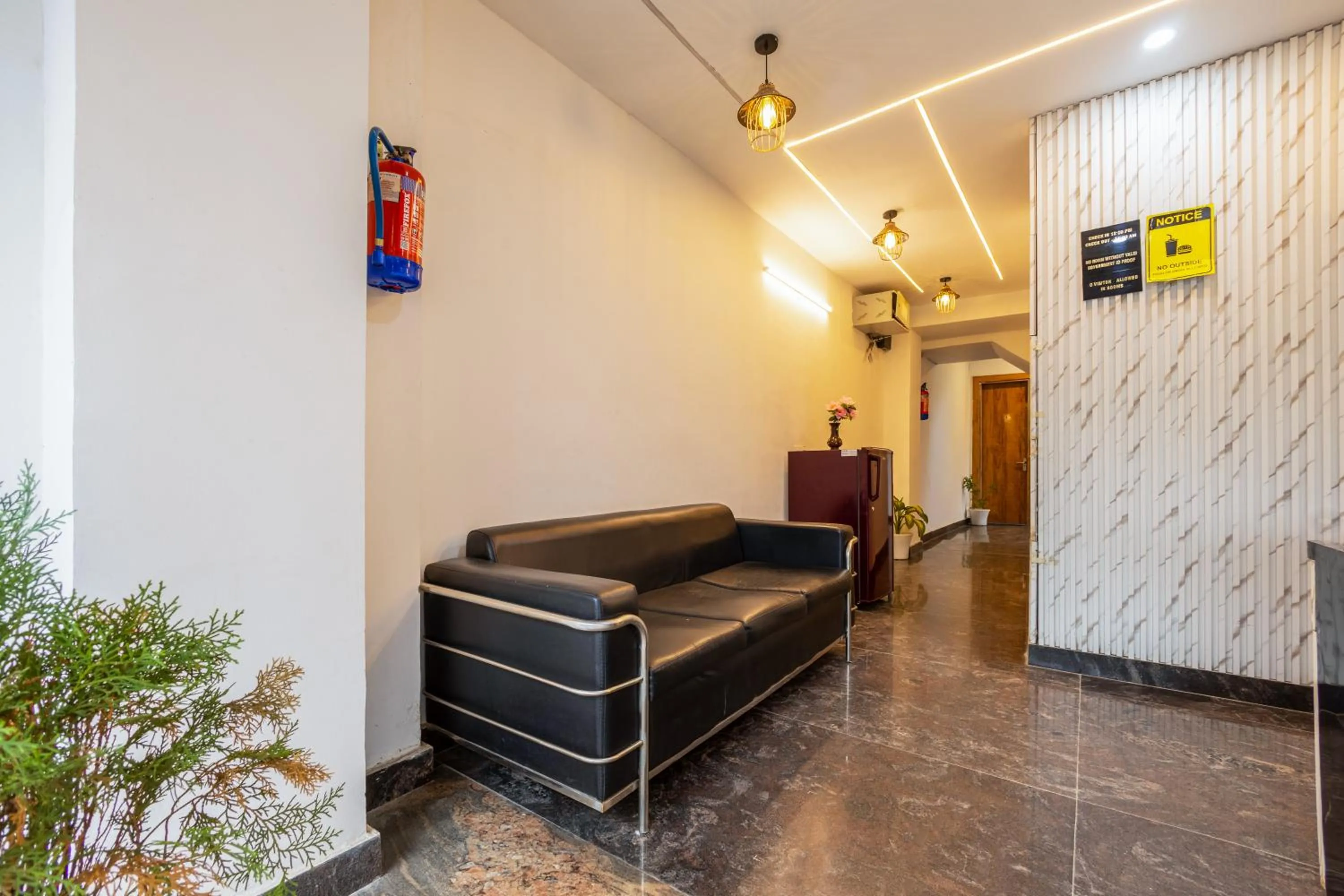 Living room in Hotel Admire Inn Sec - 104 By ASPL