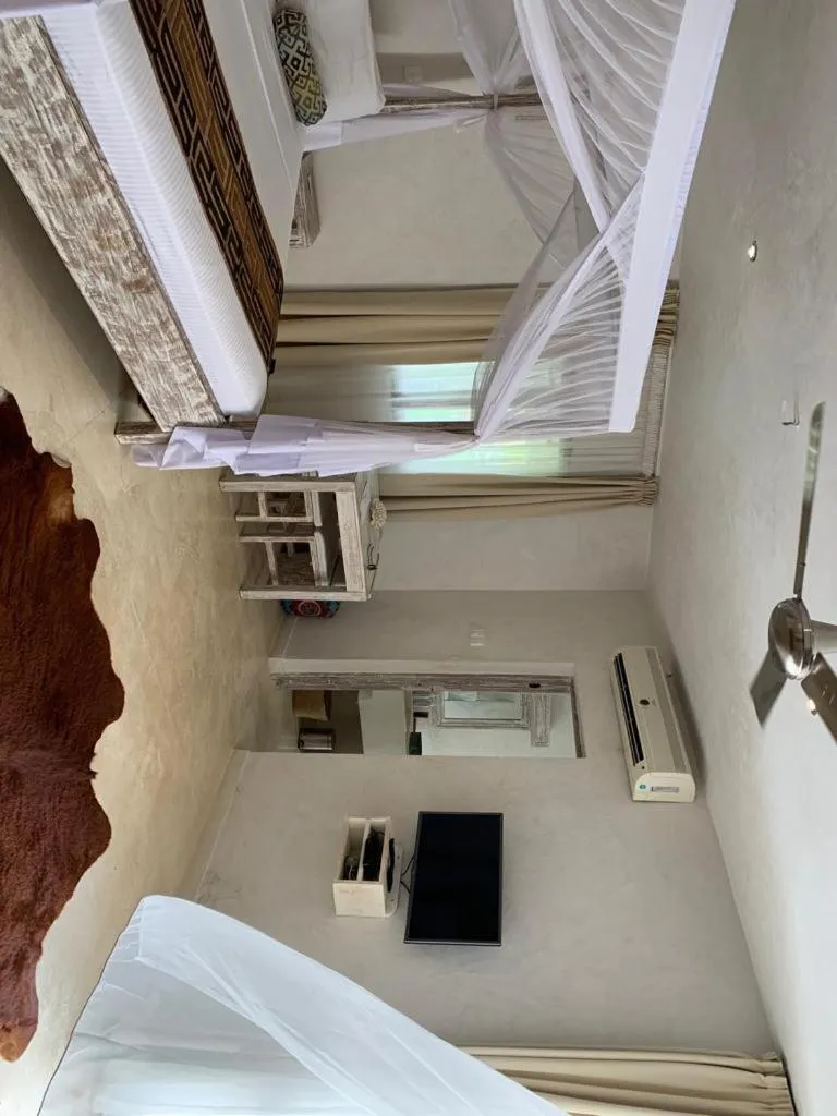 Bed in The Villa Luxury Suites Hotel