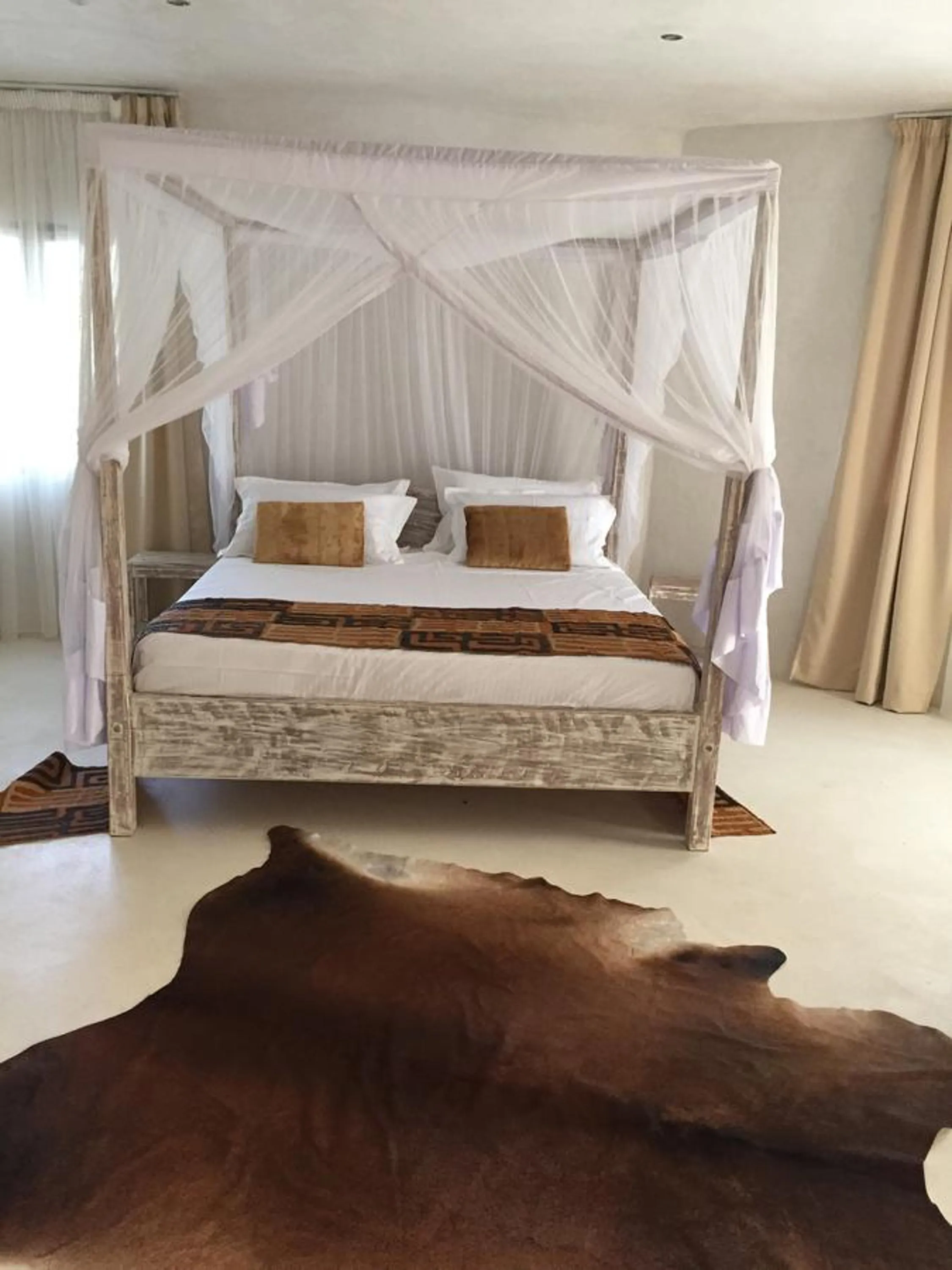 Bed in The Villa Luxury Suites Hotel